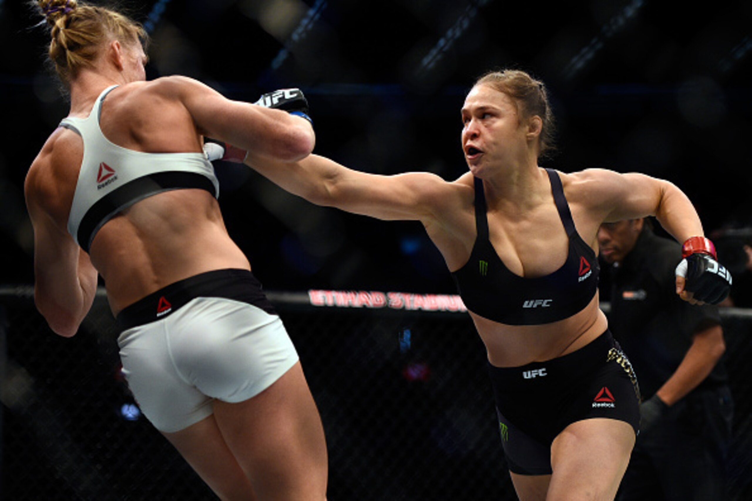 MELBOURNE, AUSTRALIA - NOVEMBER 15: (R-L) Ronda Rousey punches Holly Holm in their UFC women's bantamweight championship bout during the UFC 193 event at Etihad Stadium on November 15, 2015 in Melbourne, Australia. (Photo by Jeff Bottari/Zuffa LLC/Zuffa L