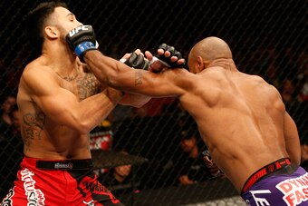 ORLANDO, FL - APRIL 19:  (R-L) Yoel Romero punches Brad Tavares in their middleweight bout during the FOX UFC Saturday event at the Amway Center on April 19, 2014 in Orlando, Florida. (Photo by Josh Hedges/Zuffa LLC/Zuffa LLC via Getty Images)