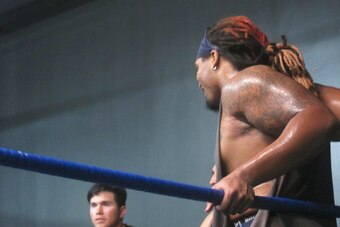 Brennan Williams listens to an in-ring lesson.