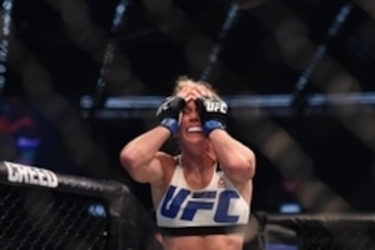Nov 15, 2015; Melbourne, Australia; Ronda Rousey (red gloves) competes against Holly Holm (blue gloves) during UFC 193 at Etihad Stadium. Mandatory Credit: Matt Roberts-USA TODAY Sports