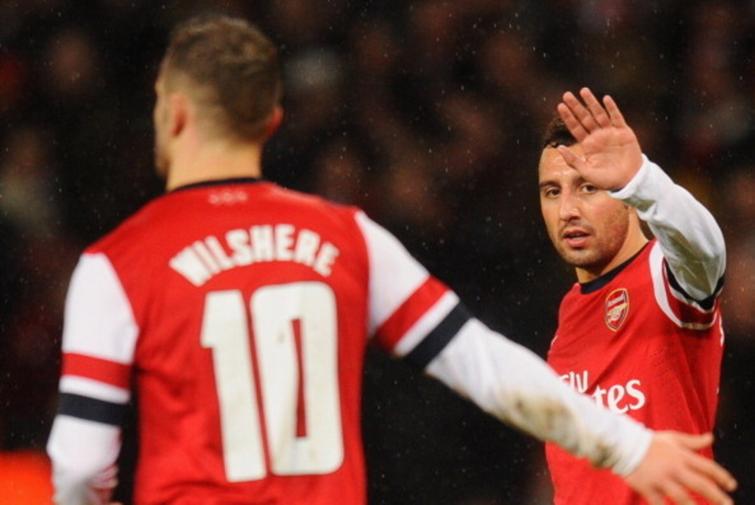 LONDON, ENGLAND - JANUARY 24:  Santi Cazorla of Arsenal (R) celebrates with Jack Wilshere of Arsenal as he scores their fourht goal during the FA Cup with Budweiser Fourth round match between Arsenal and Coventry City at Emirates Stadium on January 24, 20