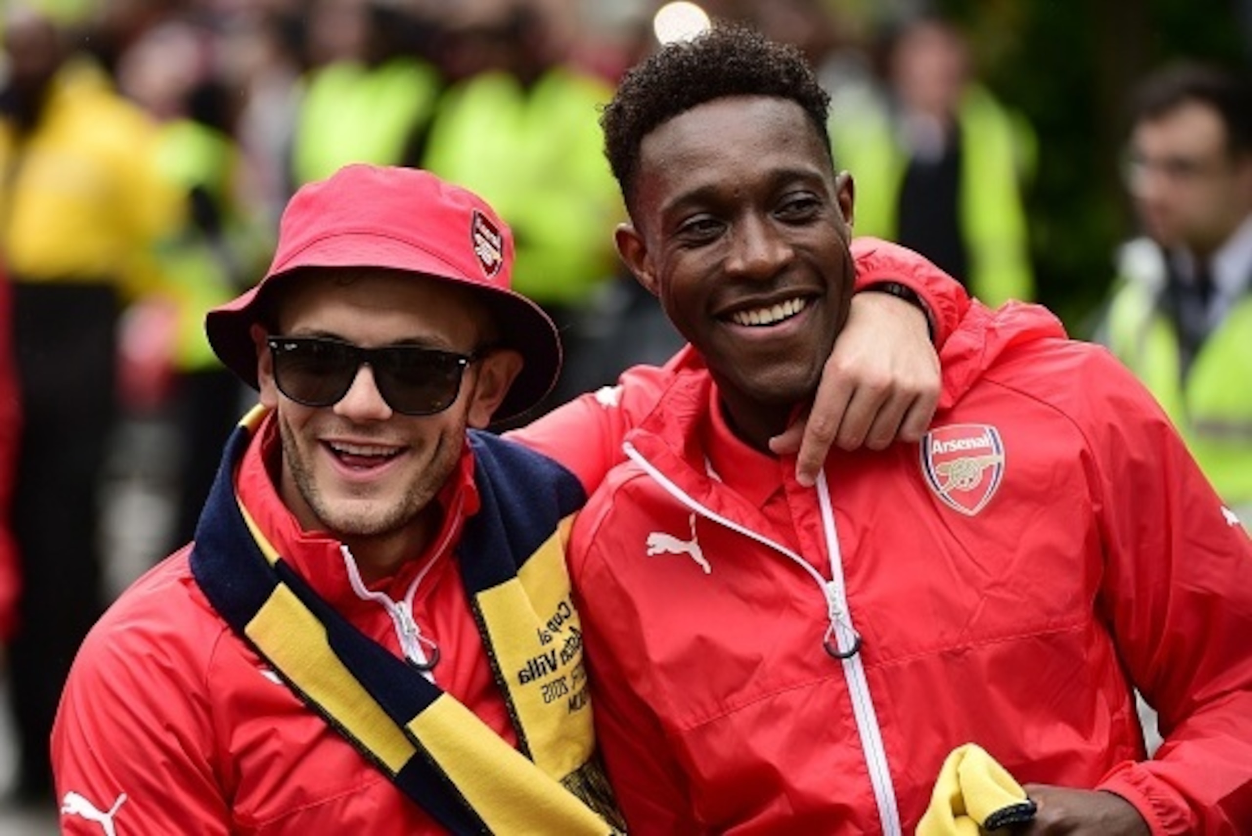 Arsenal's English midfielder Jack Wilshere and Arsenal's English striker Danny Welbeck react during the Arsenal victory parade in London on May 31, 2015, following their win in the English FA Cup final football match on May 30, 2014 against Aston Villa. A
