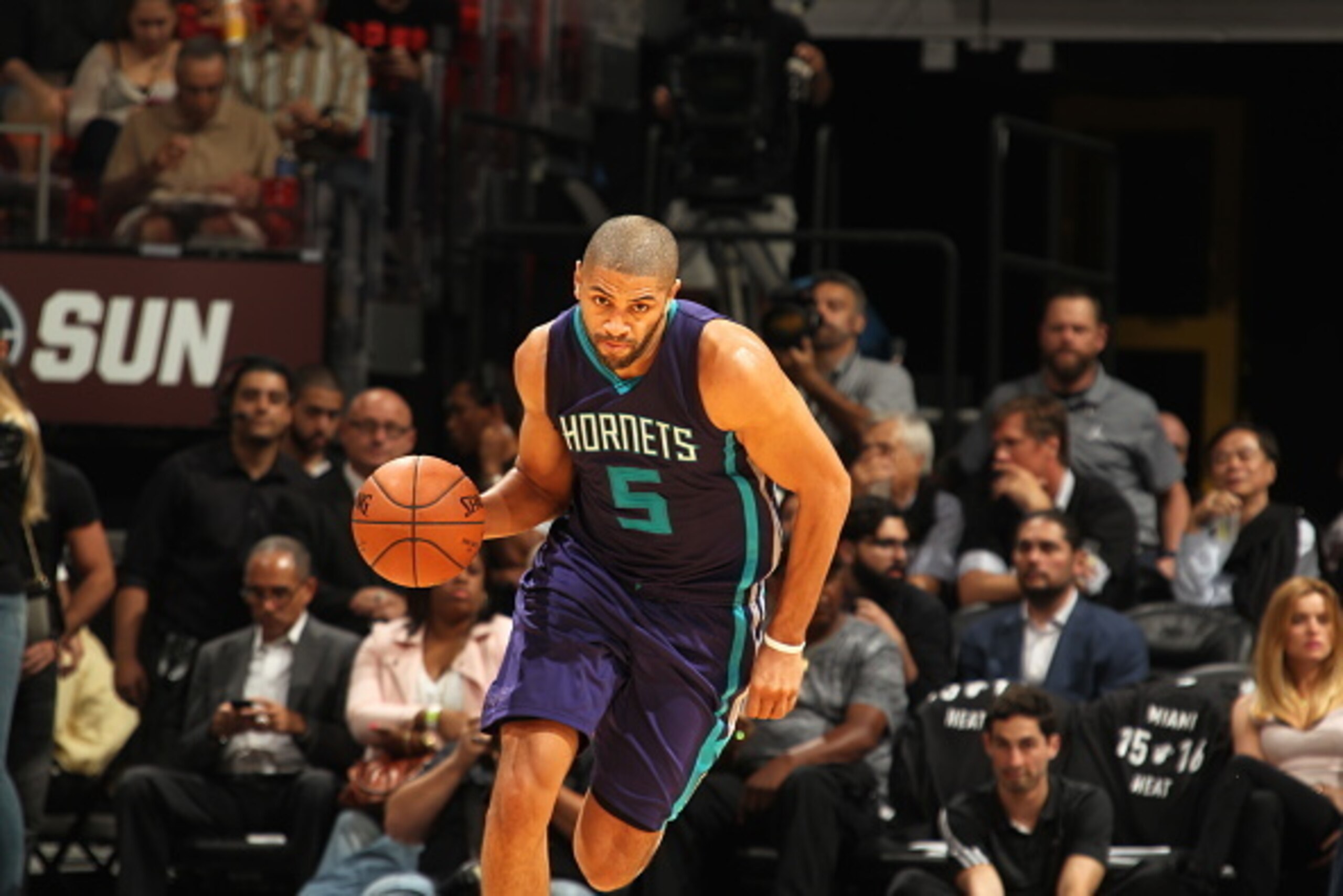 MIAMI, FL - OCTOBER 28:  Nicolas Batum #5 of the Charlotte Hornets brings the ball up court against the Miami Heat on October 28, 2015 at AmericanAirlines Arena in Miami, Florida. NOTE TO USER: User expressly acknowledges and agrees that, by downloading a