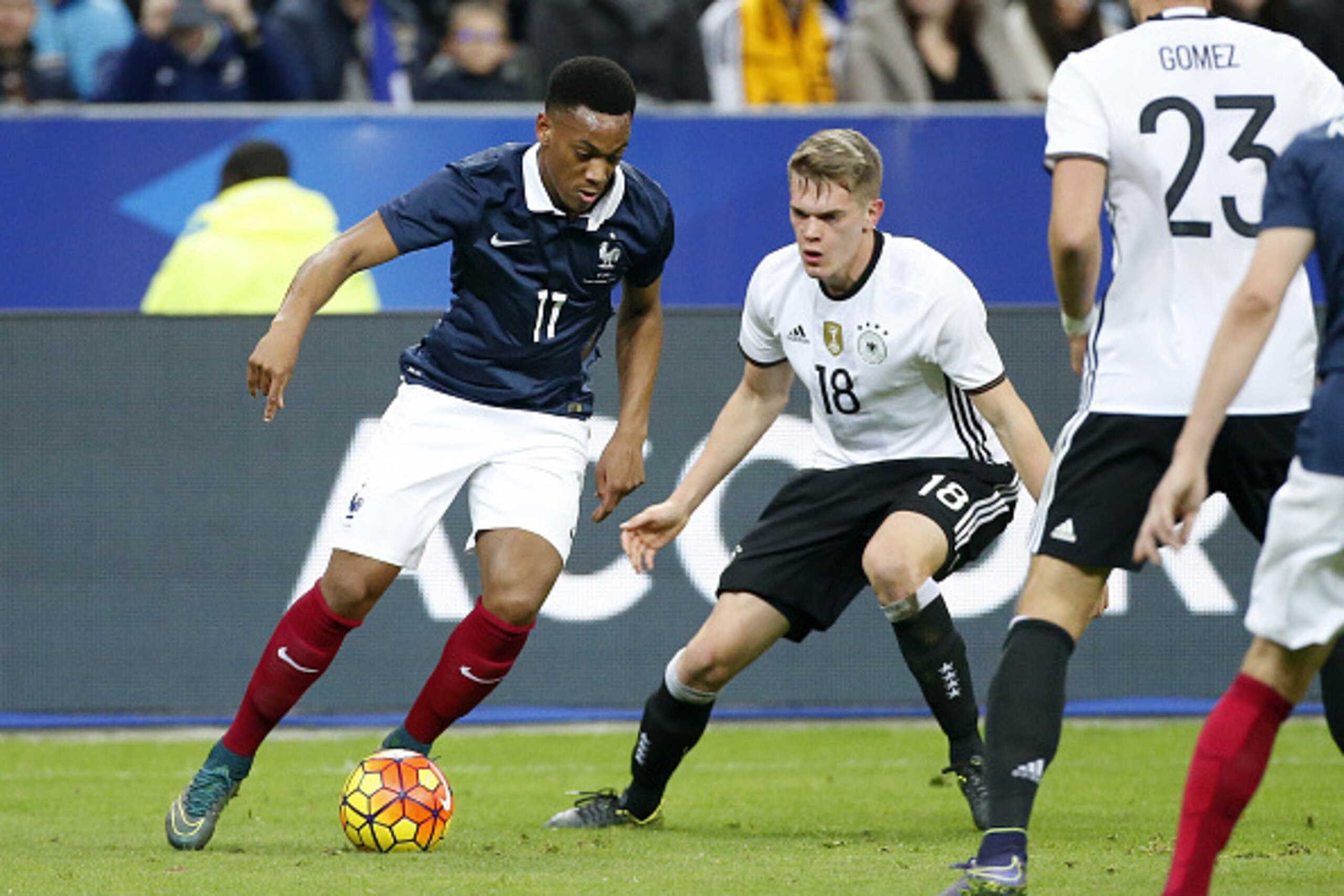 PARIS, FRANCE - NOVEMBER 13: Anthony Martial of France and Matthias Ginter of Germany in action during the international friendly match between France and Germany at Stade de France on November 13, 2015 in Saint-Denis near Paris, France. (Photo by Jean Ca