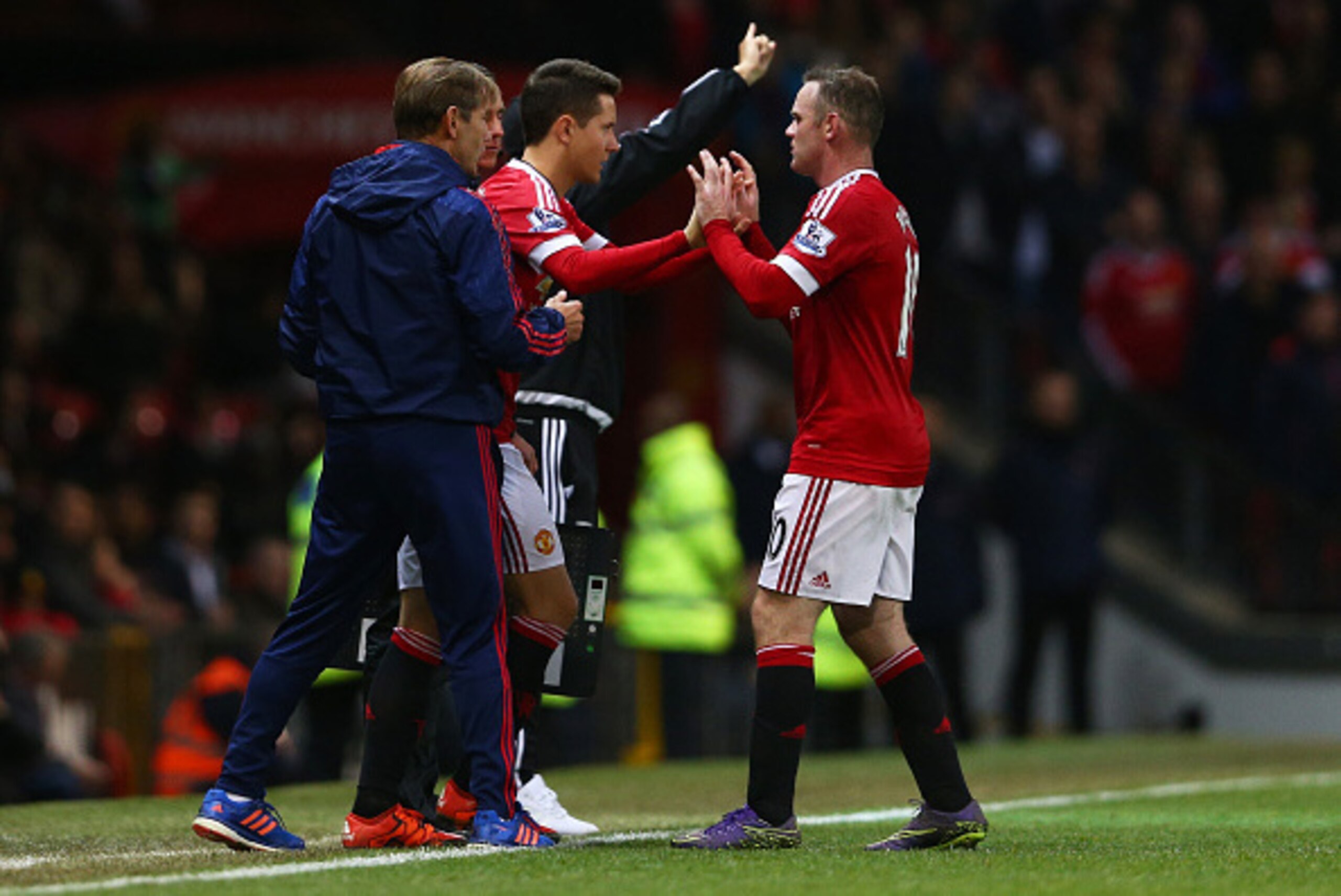 MANCHESTER, ENGLAND - NOVEMBER 07:  Ander Herrera (2nd L) replaces Wayne Rooney (R) of Manchester United during the Barclays Premier League match between Manchester United and West Bromwich Albion at Old Trafford on November 7, 2015 in Manchester, England