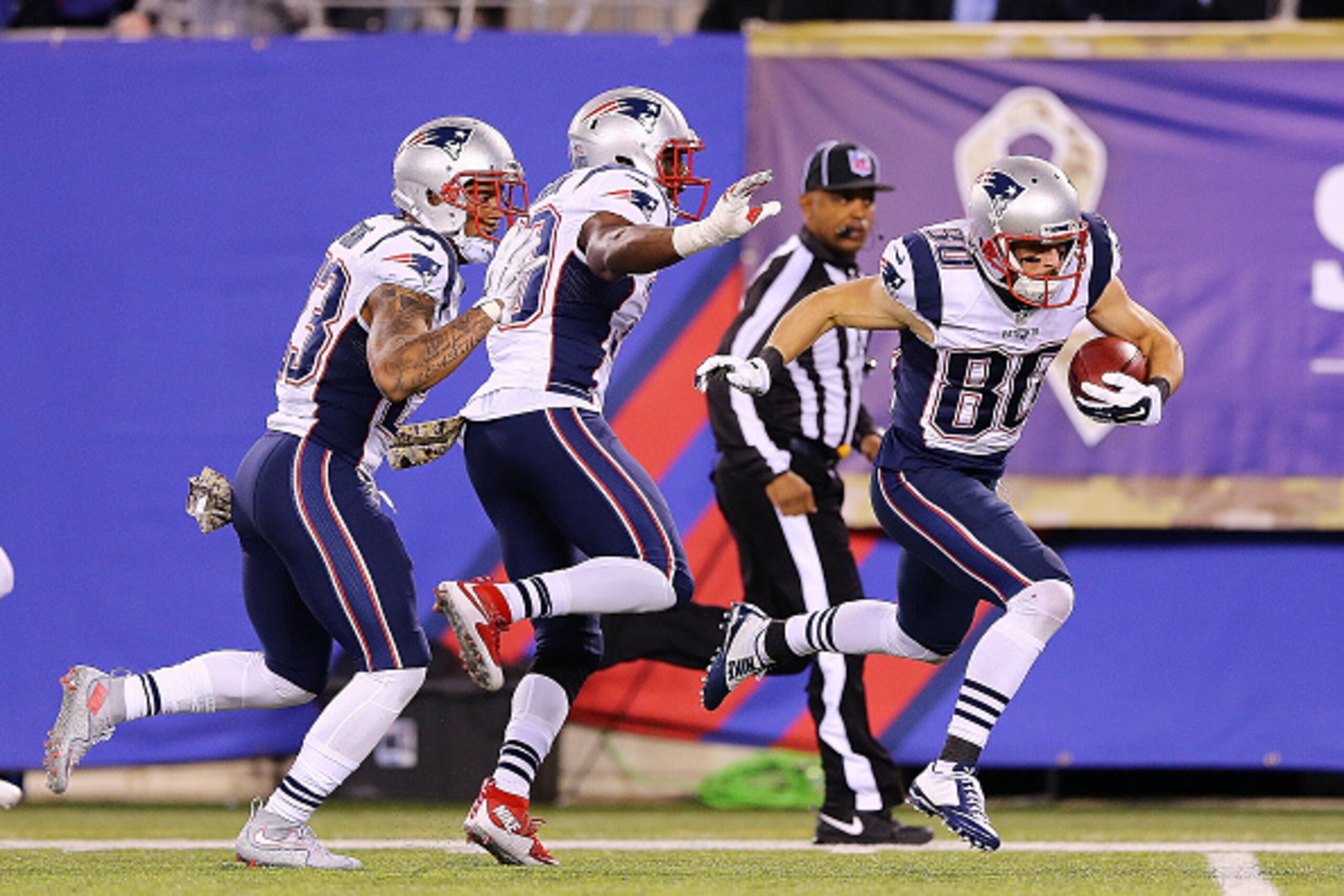 EAST RUTHERFORD, NJ - NOVEMBER 15: Danny Amendola #80 of the New England Patriots is tripped up shy of the endzone by his own teammate Duron Harmon #30 against the New York Giants during the third quarter at MetLife Stadium on November 15, 2015 in East Ru