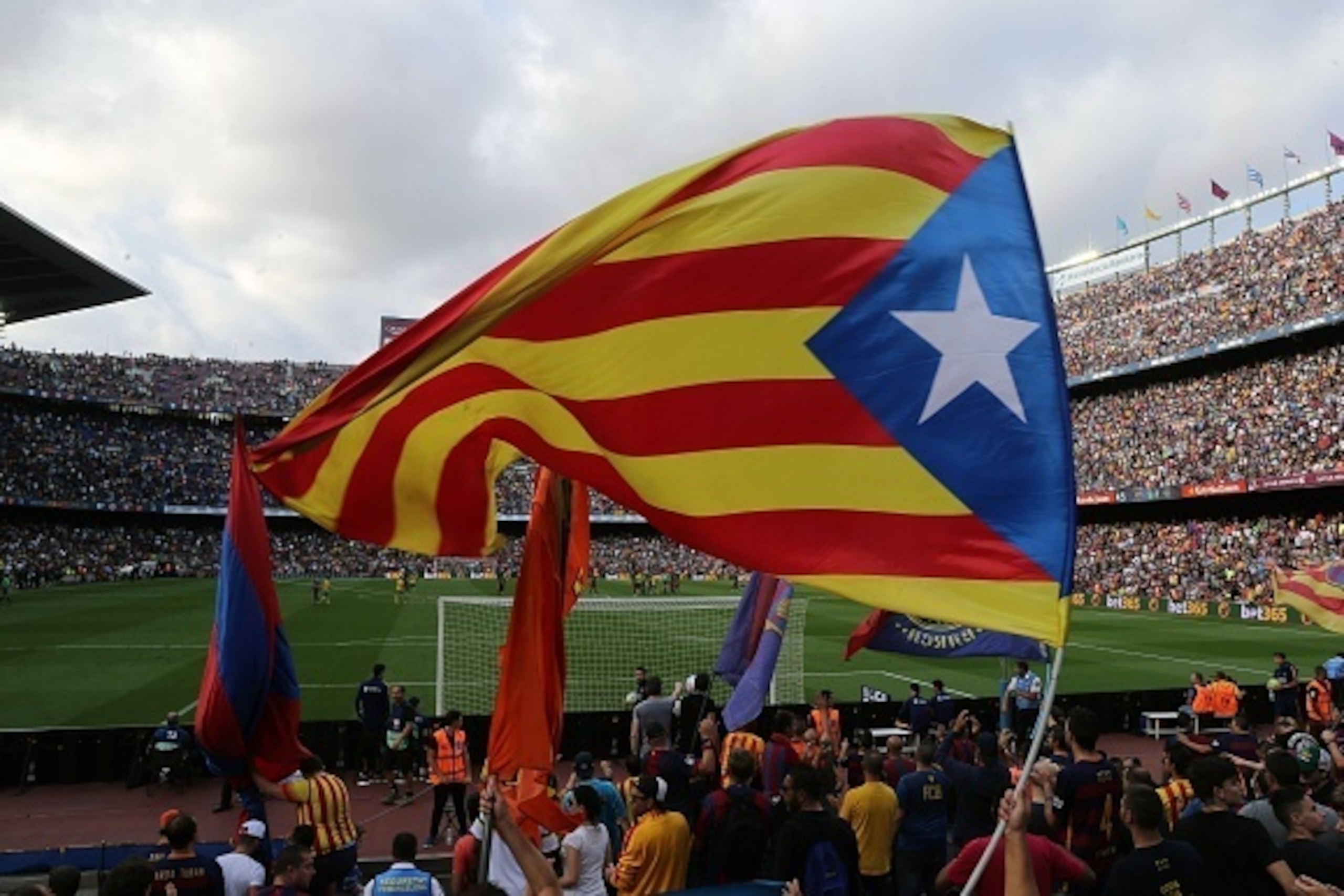 Barcelona's supporters wave the 'Estelada', pro-independent Catalonia flag, during the Spanish league football match FC Barcelona vs UD Las Palmas at the Camp Nou stadium in Barcelona on September 26, 2015. AFP PHOTO / CESAR MANSO        (Photo credit sho