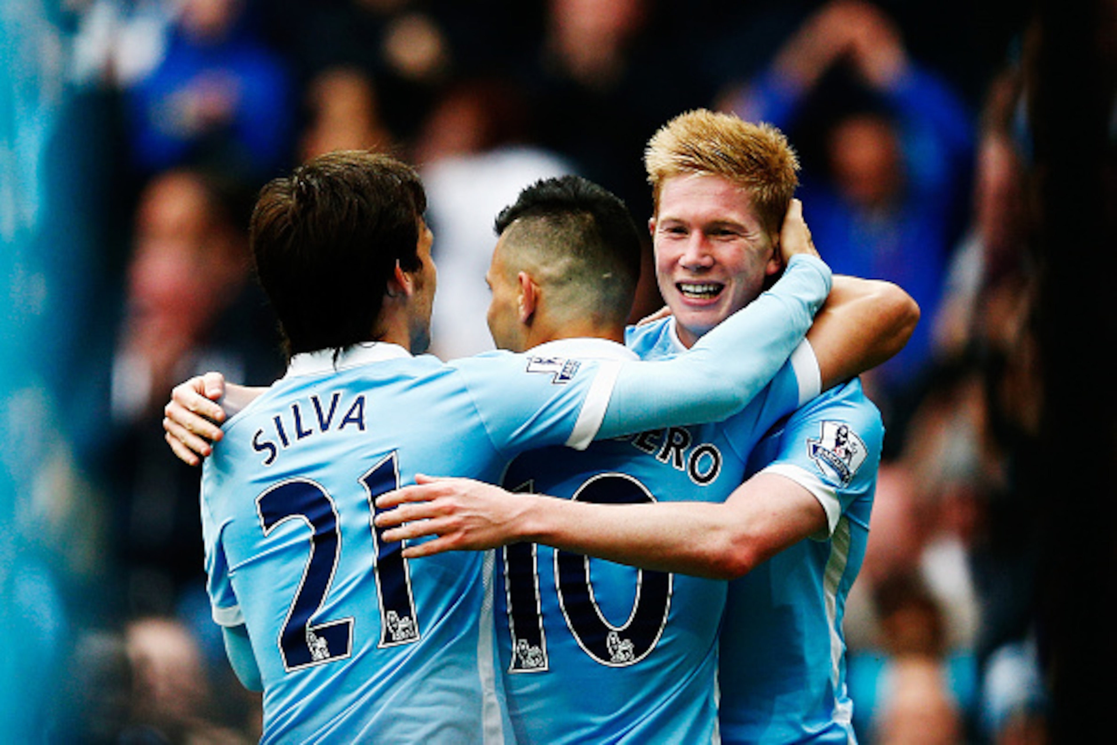 MANCHESTER, ENGLAND - OCTOBER 03:  Sergio Aguero (C) of Manchester City celebrates scoring his fourth and team's fifth goal with David Silva (L) and Kevin de Bruyne (R) during the Barclays Premier League match between Manchester City and Newcastle United 
