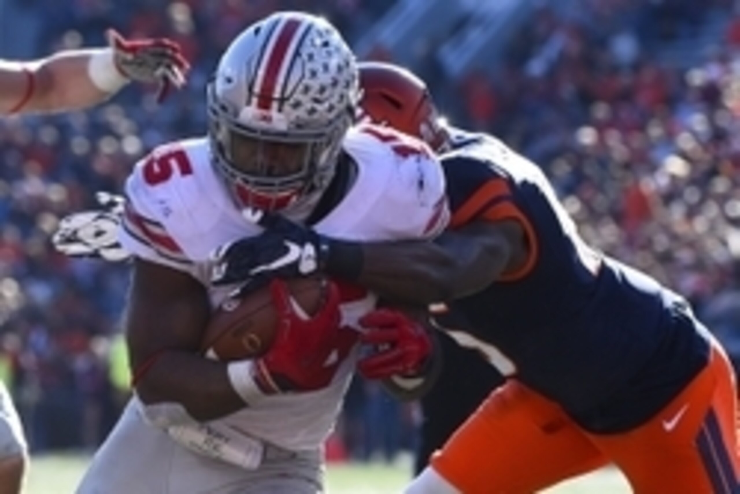 Nov 14, 2015; Champaign, IL, USA; Ohio State Buckeyes running back Ezekiel Elliott (15) rushes for a touchdown against the Illinois Fighting Illini during the fourth quarter at Memorial Stadium. Ohio State defats Illinois 28-3. Mandatory Credit: Mike DiNo