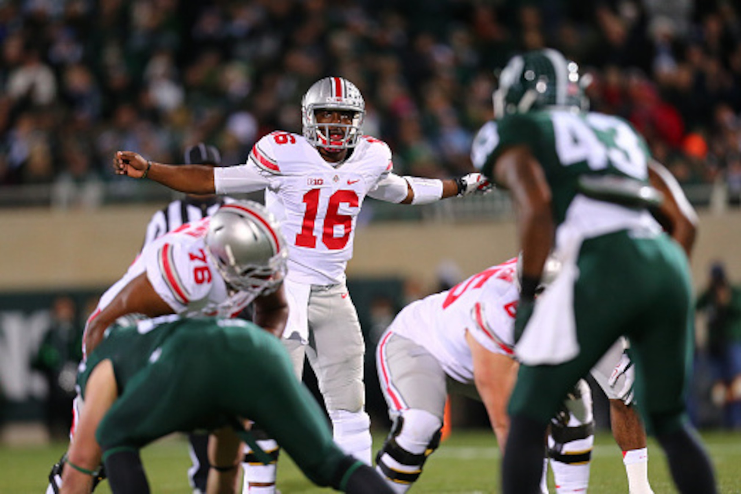 EAST LANSING, MI - NOVEMBER 8:  J.T. Barrett #16 of the Ohio State Buckeyes during the game against the Michigan State Spartans at Spartan Stadium on November 8, 2014 in East Lansing, Michigan. (Photo by Rey Del Rio/Getty Images)