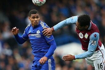 Aston Villa's English defender Joleon Lescott (R) vies for the ball against Chelsea's English midfielder Ruben Loftus-Cheek during the English Premier League football match between Chelsea and Aston Villa at Stamford Bridge in London on October 17, 2015. 
