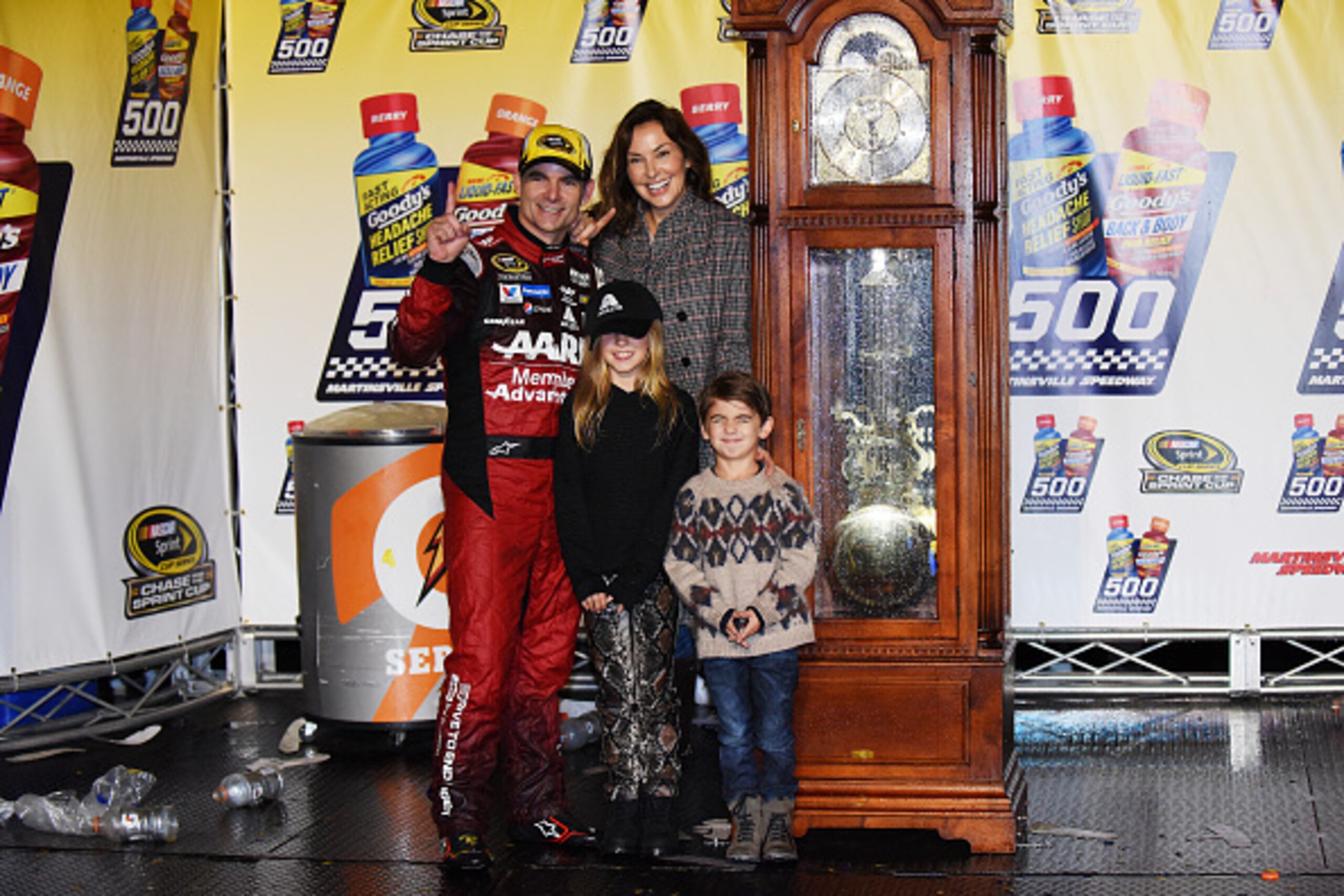 MARTINSVILLE, VA - NOVEMBER 01:  Jeff Gordon, driver of the #24 AARP Member Advantages Chevrolet, celebrates in Victory Lane with his wife Ingrid Vandebosch, daughter Ella and son Leo after winning the NASCAR Sprint Cup Series Goody's Headache Relief Shot