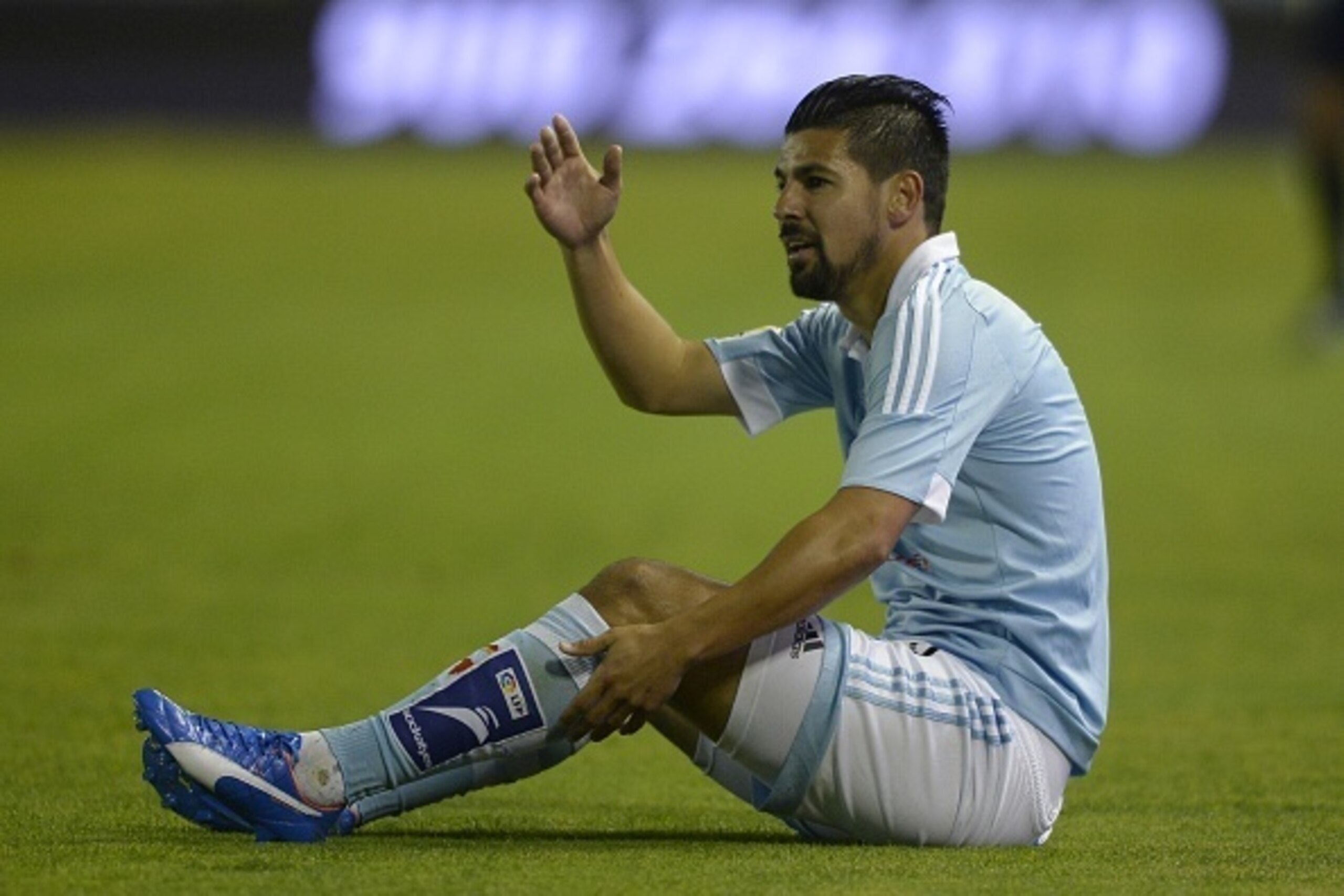 Celta Vigo's forward  Nolito sits on the field during the Spanish league football match Celta Vigo vs Getafe CF at the Balaidos stadium in Vigo on October 2, 2015.   AFP PHOTO / MIGUEL RIOPA        (Photo credit should read MIGUEL RIOPA/AFP/Getty Images)