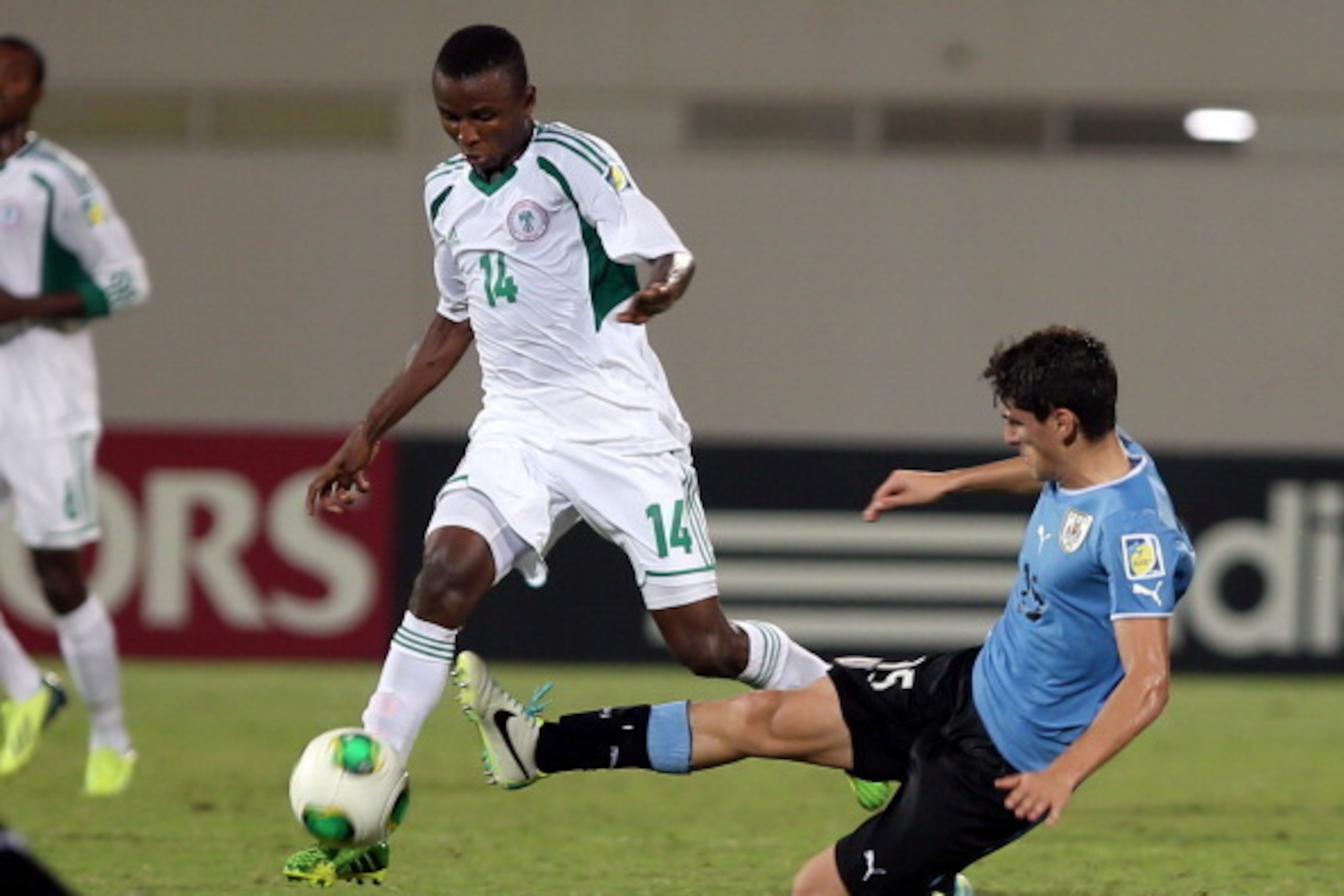 Gaston Faber (R) of Uruguay fights for the ball against Chidiebere Nwakali of Nigeria during their FIFA U-17 World Cup UAE 2013 football match in Sharjah on November 2, 2013. AFP PHOTO / STR        (Photo credit should read -/AFP/Getty Images)