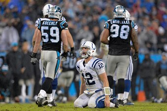 CHARLOTTE, NC - NOVEMBER 02:  Andrew Luck #12 of the Indianapolis Colts sits on the ground after throwing an incompletion against the Carolina Panthers during their game at Bank of America Stadium on November 2, 2015 in Charlotte, North Carolina. The Pant