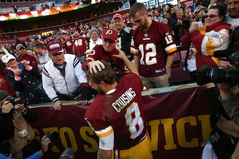 LANDOVER, MD - NOVEMBER 15: Quarterback Kirk Cousins #8 of the Washington Redskins celebrates with fans after the Washington Redskins defeated the New Orleans Saints 47-14 during a game at FedExField on November 15, 2015 in Landover, Maryland. (Photo by M