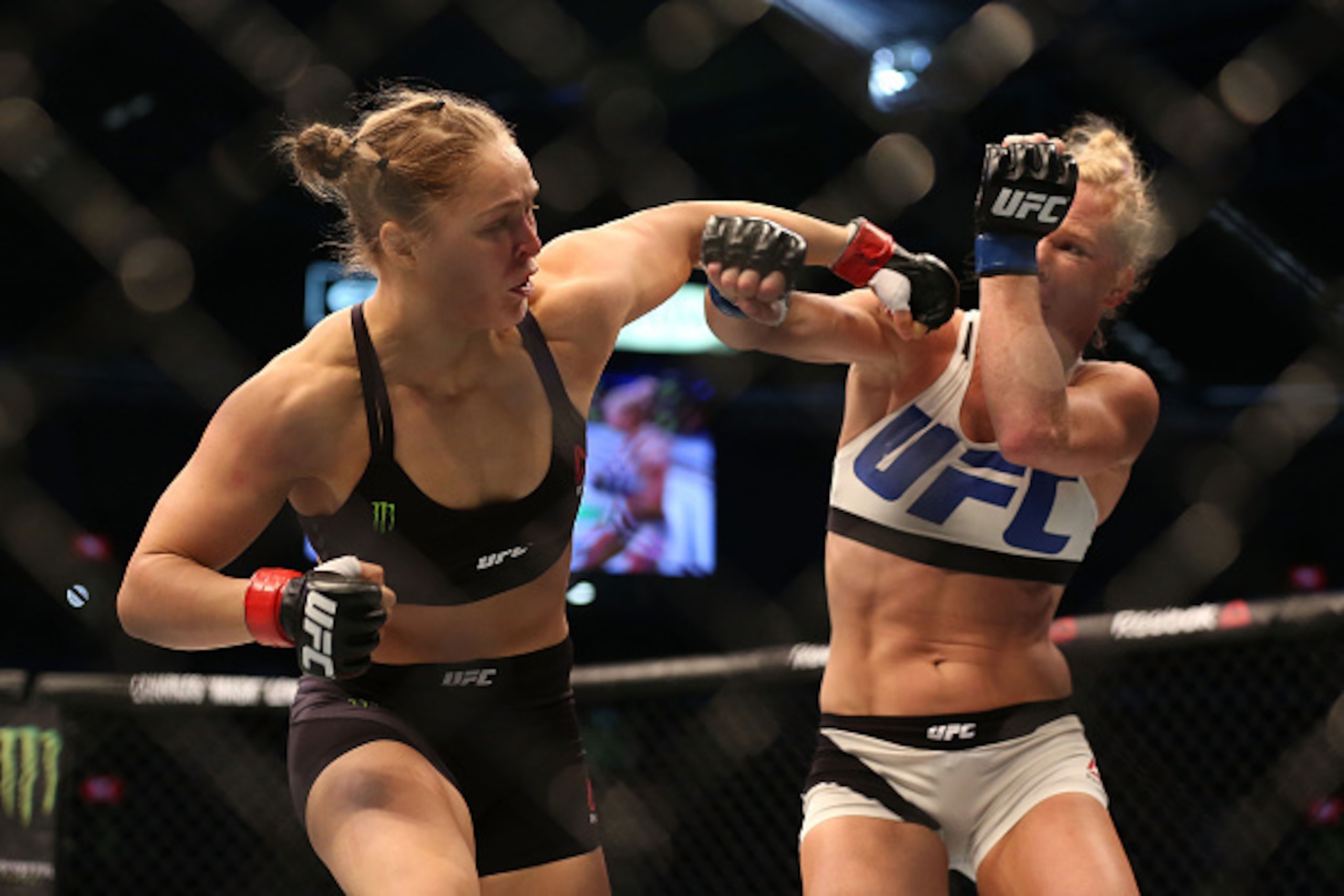 MELBOURNE, AUSTRALIA - NOVEMBER 15: Ronda Rousey of the United States (L) and Holly Holm of the United States compete in their UFC women's bantamweight championship bout during the UFC 193 event at Etihad Stadium on November 15, 2015 in Melbourne, Austra MELBOURNE, AUSTRALIA - NOVEMBER 15: Ronda Rousey of the United States (L) and Holly Holm of the United States compete in their UFC women's bantamweight championship bout during the UFC 193 event at Etihad Stadium on November 15, 2015 in Melbourne, Austra