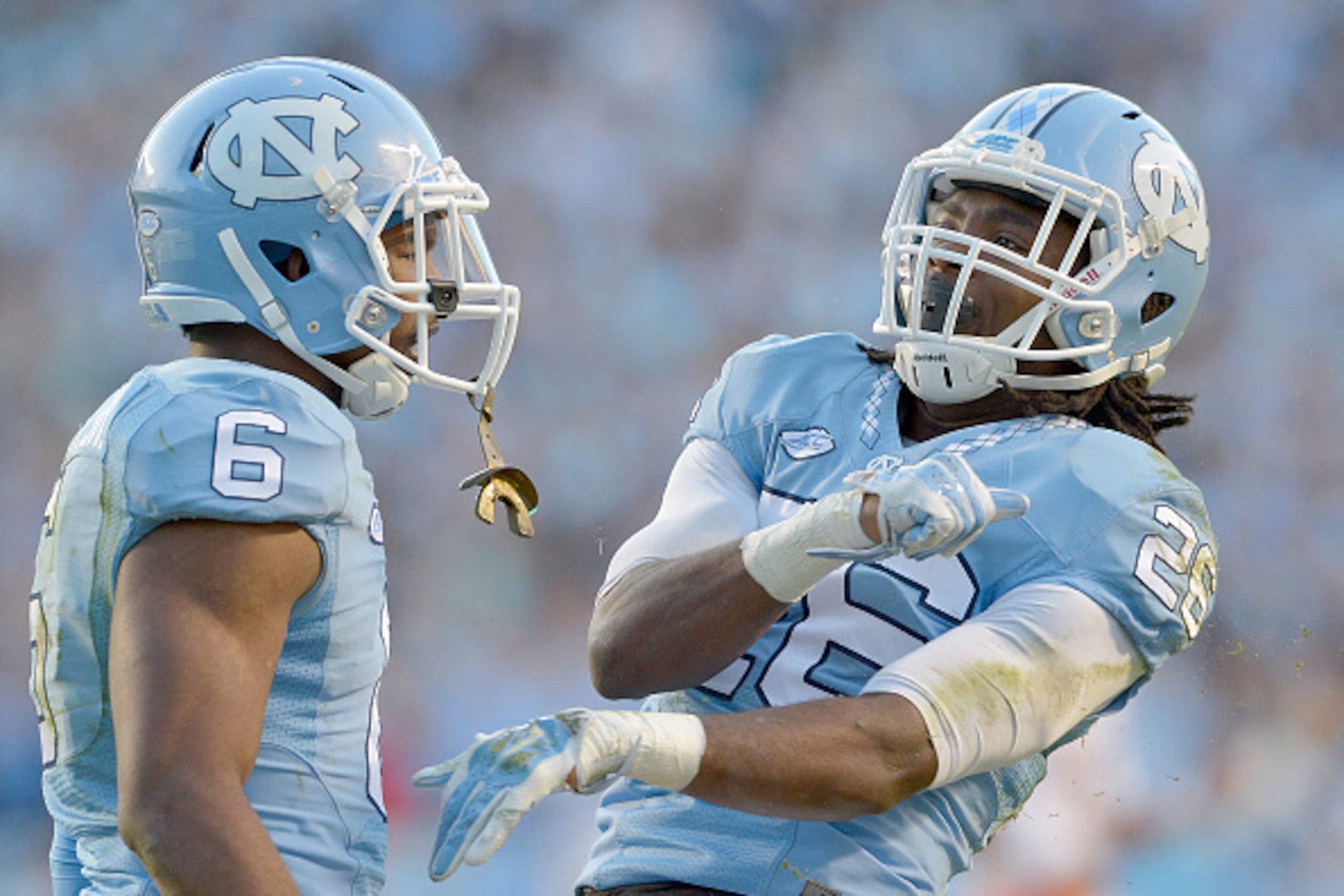 CHAPEL HILL, NC - NOVEMBER 14:  M.J. Stewart #6 and Dominquie Green #26 of the North Carolina Tar Heels reacts after a defensive stop against the Miami Hurricanes during their game at Kenan Stadium on November 14, 2015 in Chapel Hill, North Carolina. Nort