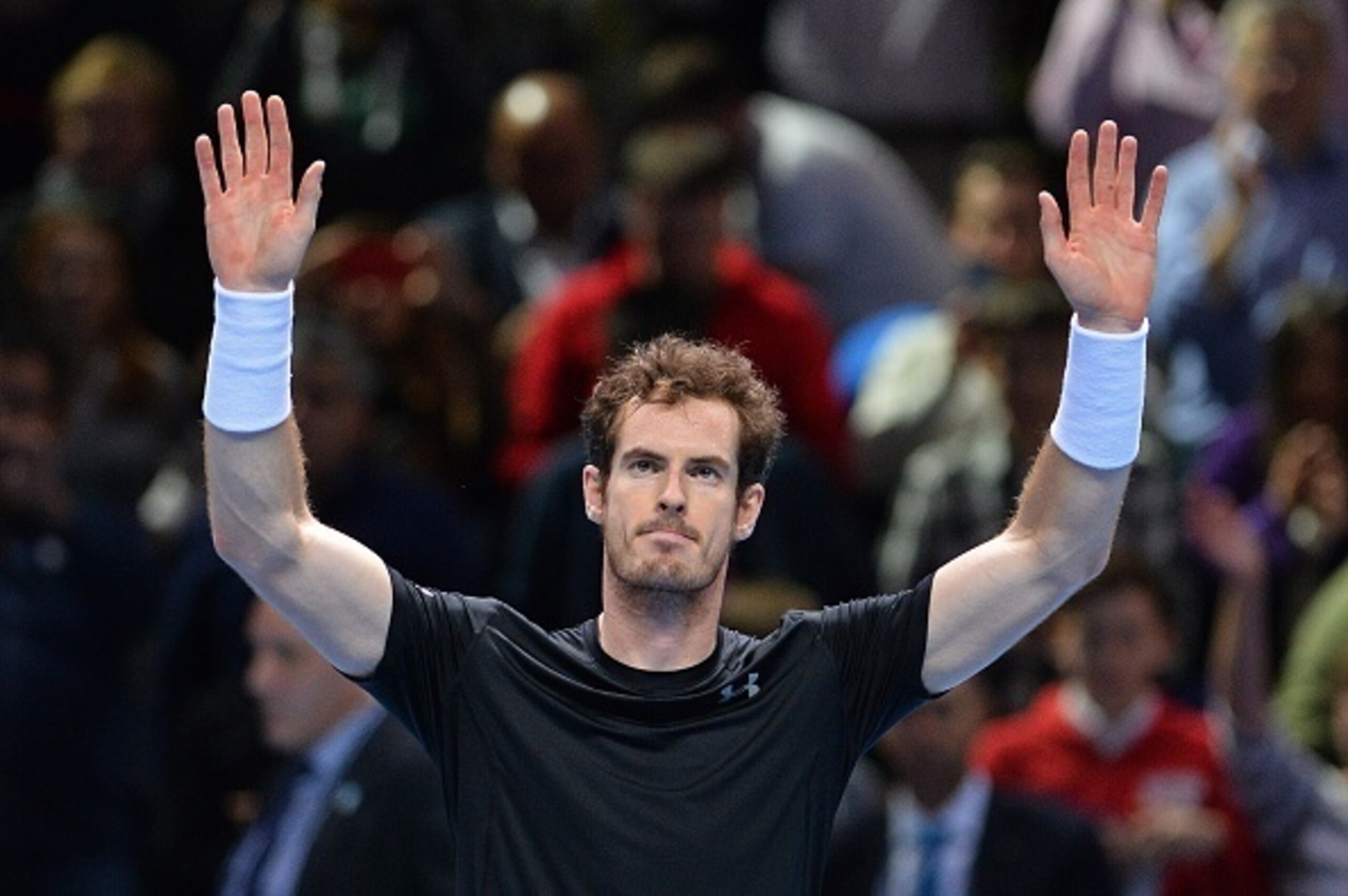 Britain's Andy Murray waves to the crowd after winning his men's singles group stage match against Spain's David Ferrer on day two of the ATP World Tour Finals tennis tournament in London on November 16, 2015. Murray won the match 6-4, 6-4. AFP PHOTO / GL