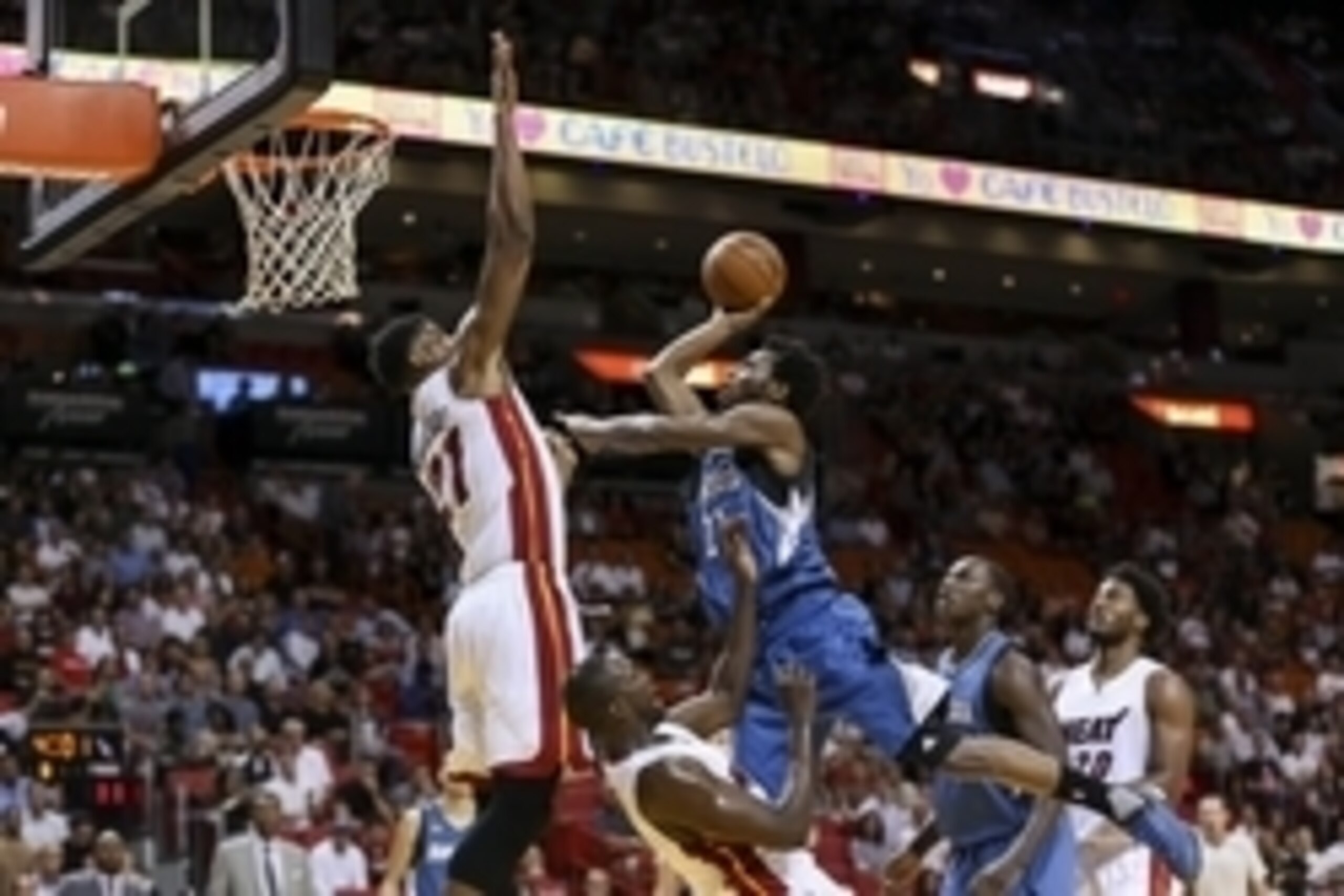 Nov 17, 2015; Miami, FL, USA; Minnesota Timberwolves guard Andrew Wiggins (right) collides into Miami Heat forward Luol Deng (bottom) as Miami Heat center Hassan Whiteside (left) blocks the basket during the first half at American Airlines Arena. Mandator Nov 17, 2015; Miami, FL, USA; Minnesota Timberwolves guard Andrew Wiggins (right) collides into Miami Heat forward Luol Deng (bottom) as Miami Heat center Hassan Whiteside (left) blocks the basket during the first half at American Airlines Arena. Mandator
