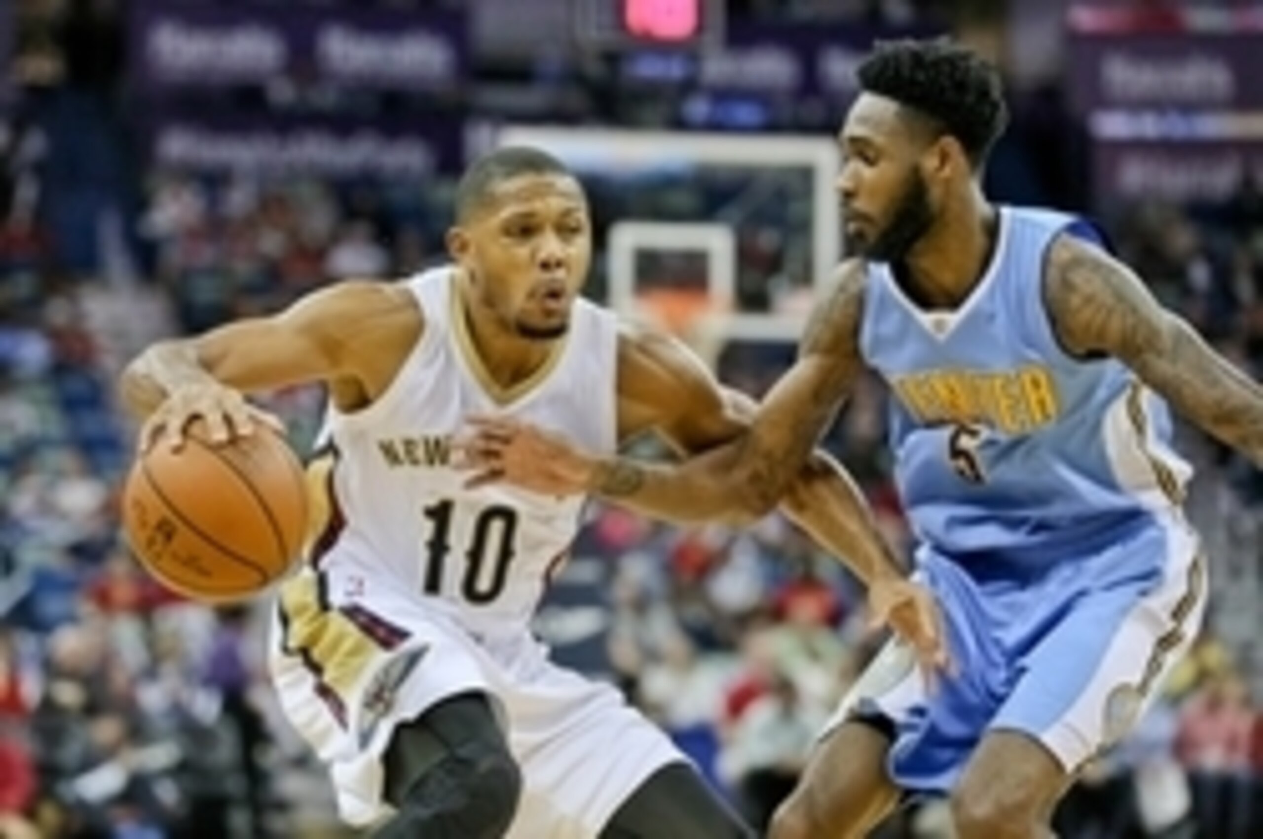 Nov 17, 2015; New Orleans, LA, USA; New Orleans Pelicans guard Eric Gordon (10) is guarded by Denver Nuggets forward Will Barton (5) during the second half of a game at the Smoothie King Center. Denver defeated the Pelicans 115-98. Mandatory Credit: Deric
