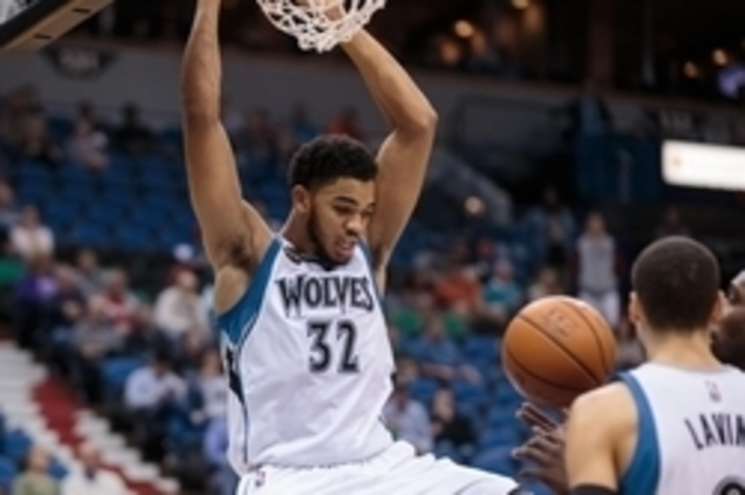 Nov 15, 2015; Minneapolis, MN, USA; Minnesota Timberwolves center Karl-Anthony Towns (32) dunks the ball in the fourth quarter against the Memphis Grizzlies at Target Center. The Grizzlies won 114-106. Mandatory Credit: Brad Rempel-USA TODAY Sports