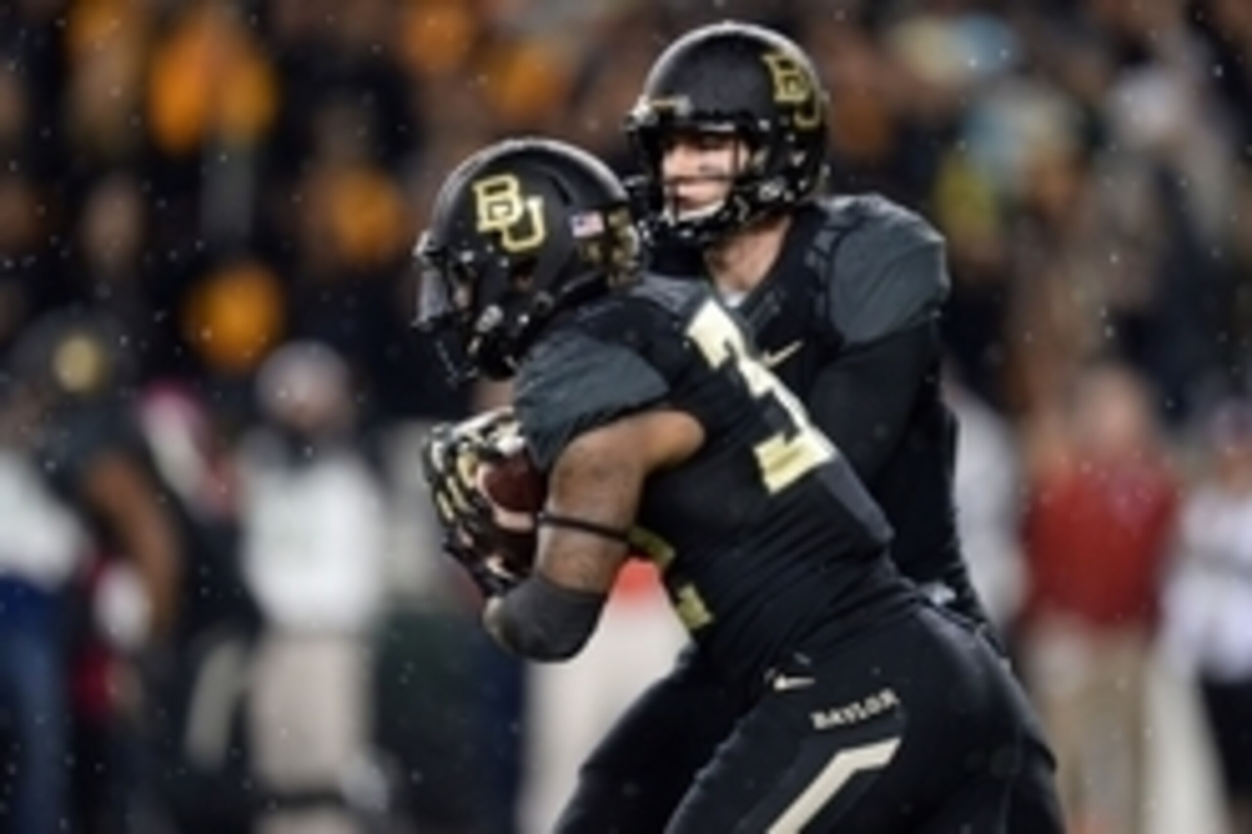 Nov 14, 2015; Waco, TX, USA; Baylor Bears quarterback Jarrett Stidham (3) hands off to running back Shock Linwood (32) against the Oklahoma Sooners during the first half at McLane Stadium. Mandatory Credit: Joe Camporeale-USA TODAY Sports