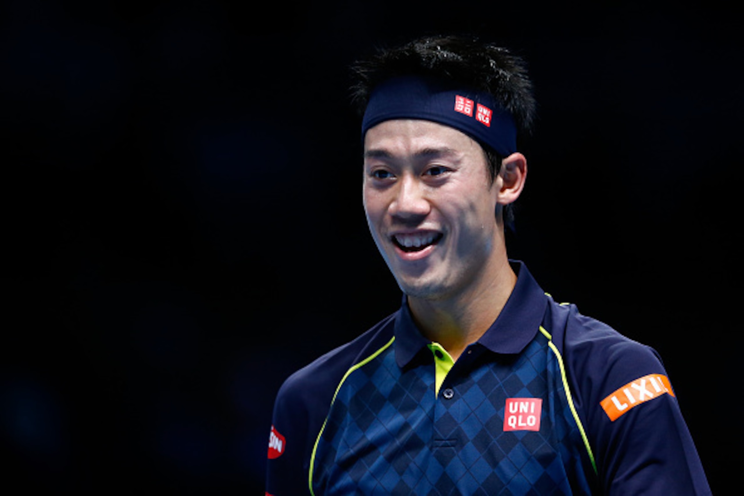 LONDON, ENGLAND - NOVEMBER 17:  Kei Nishikori of Japan smiles as he walks off court in between games in his men's singles match against Tomas Berdych of Czech Republic during day three of the Barclays ATP World Tour Finals at the O2 Arena on November 17, 