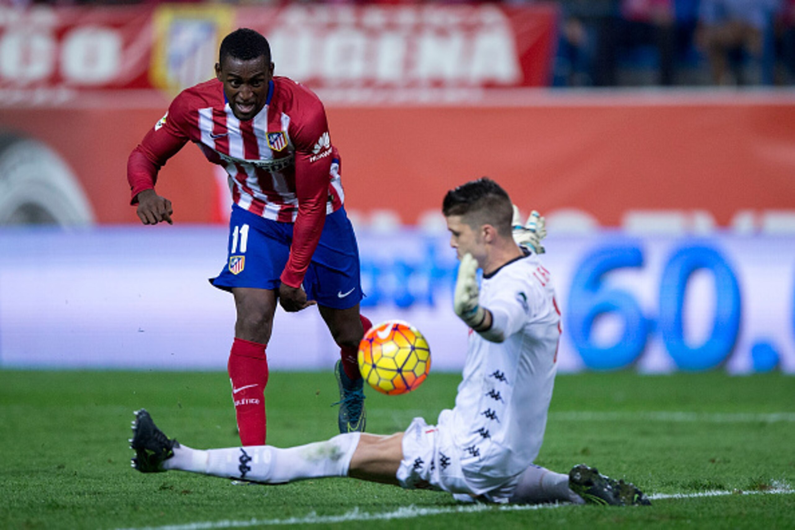 MADRID, SPAIN - NOVEMBER 08: goalkeeper Ivan Cuellar (R) of Real Sporting de Gijon stops the ball striked by Jackson Arley Martinez  (L) of Atletico de Madrid during the La Liga mathc bewteen Club Atletico de Madrid and Real Sporting de Gijon at Vicente C