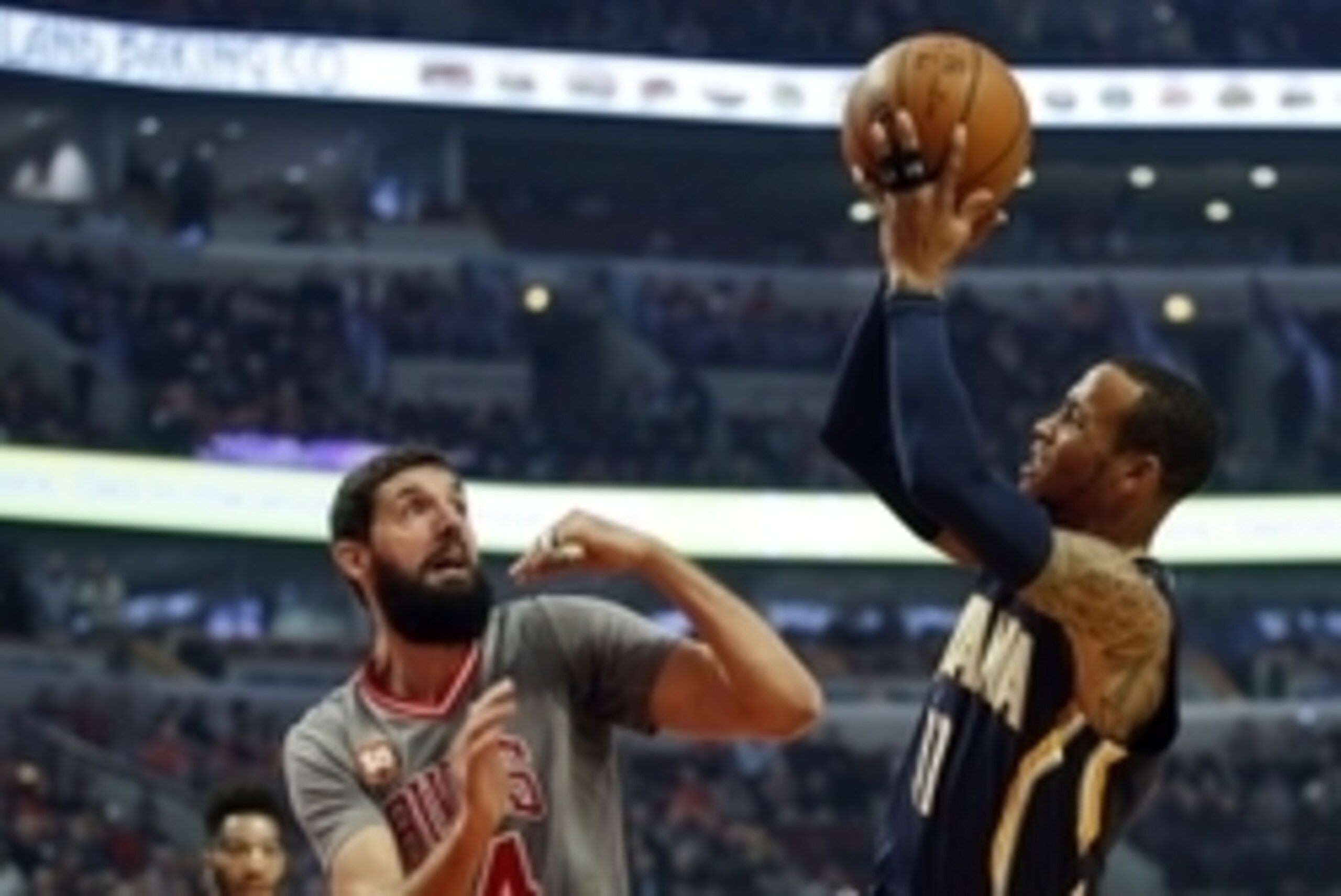 Nov 16, 2015; Chicago, IL, USA; Indiana Pacers guard Monta Ellis (11) shoots against Chicago Bulls forward Nikola Mirotic (44) during the first half at United Center. Mandatory Credit: Kamil Krzaczynski-USA TODAY Sports