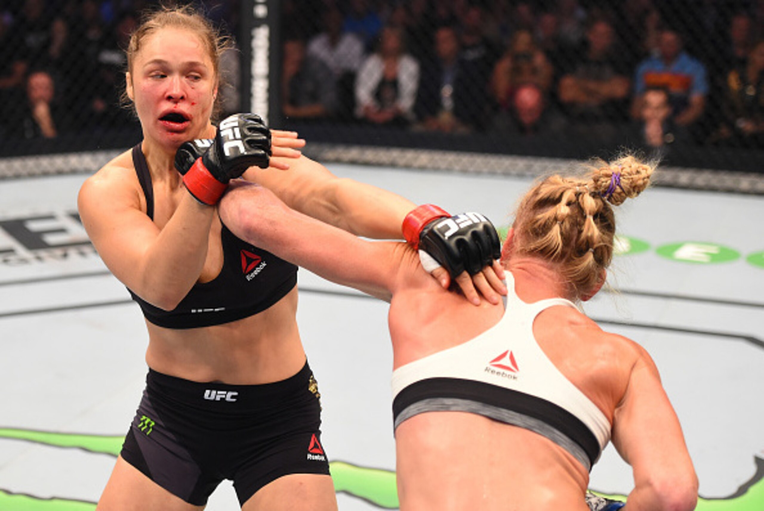 MELBOURNE, AUSTRALIA - NOVEMBER 15:  (R-L) Holly Holm of the United States punches Ronda Rousey of the United States in their UFC women's bantamweight championship bout during the UFC 193 event at Etihad Stadium on November 15, 2015 in Melbourne, Australi