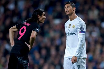 MADRID, SPAIN - NOVEMBER 03: Cristiano Ronaldo (R) of Real Madrid CF reacts as he fail to score as Edinson Cavani (L) of Paris Saint-Germain speaks to him during the UEFA Champions League Group A match between Real Madrid CF and Paris Saint-Germain at Est