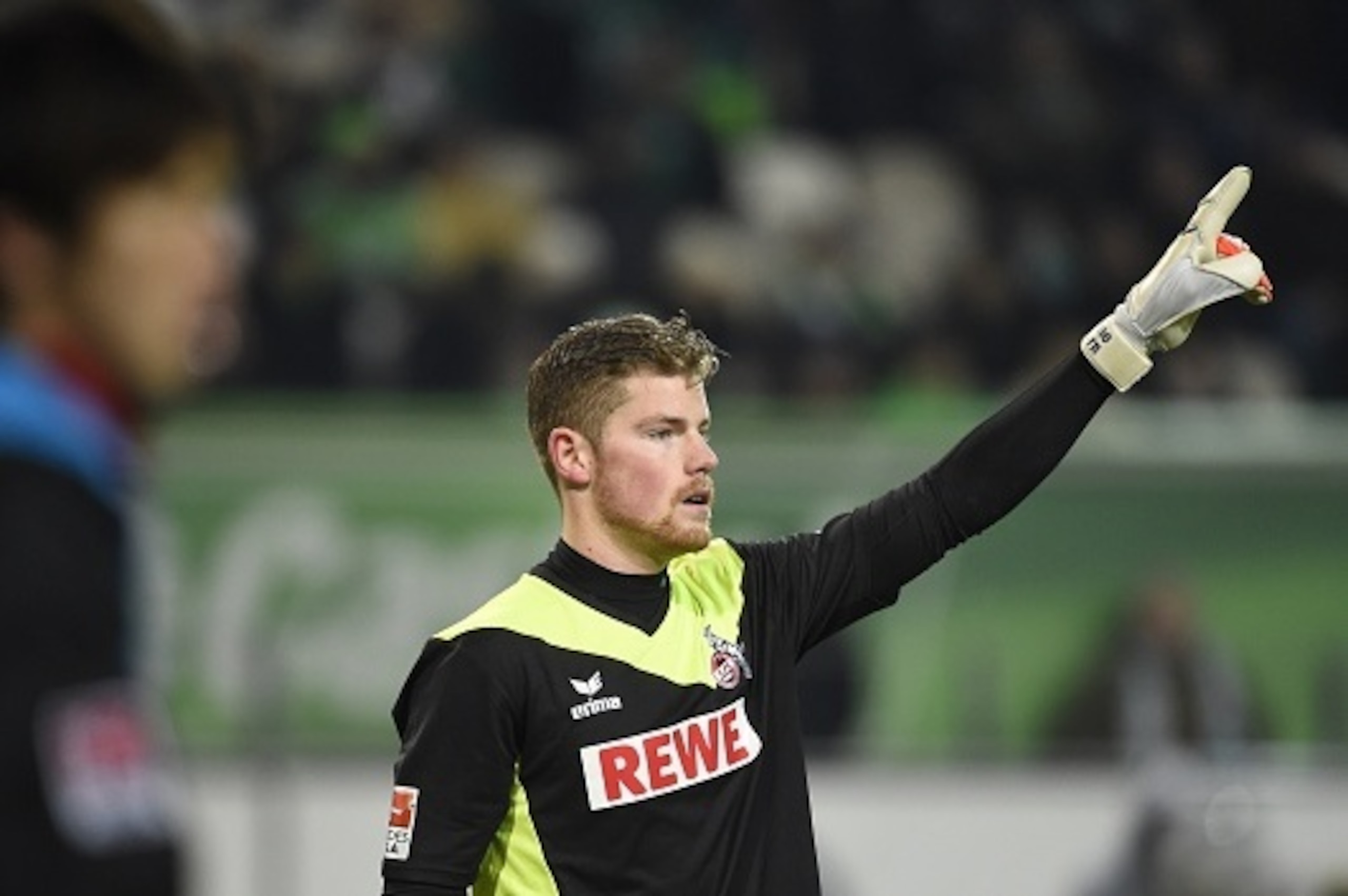 Cologne's goalkeeper Timo Horn raises his hand during the German first division Bundesliga football match VfL Wolfsburg vs 1 FC Cologne at the Volkswagen Arena in Wolfsburg, central Germany on December 20, 2014. AFP PHOTO / TOBIAS SCHWARZ  RESTRICTIONS - 
