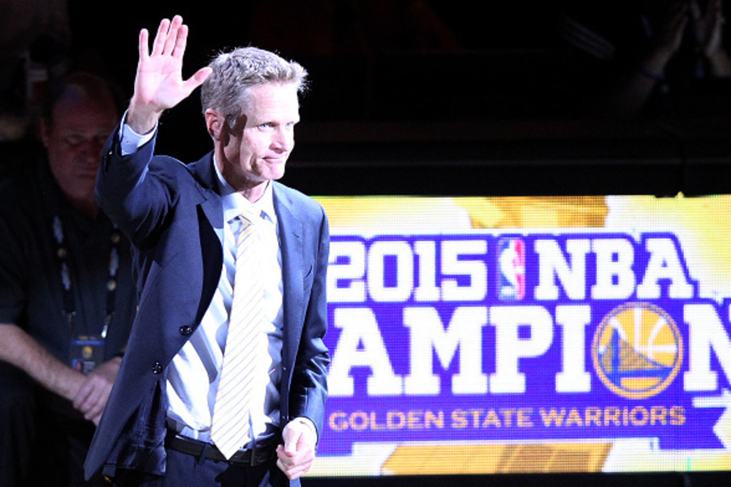 OAKLAND, CA - OCTOBER 27:  Head coach Steve Kerr of the Golden State Warriors waves to the crowd during the championship ring ceremony prior to their NBA season opener against the New Orleans Pelicans at ORACLE Arena on October 27, 2015 in Oakland, Califo