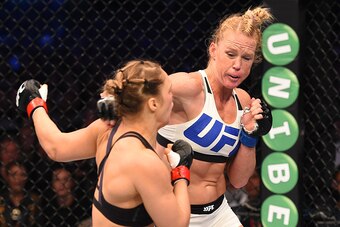 MELBOURNE, AUSTRALIA - NOVEMBER 15:  (R-L) Holly Holm of the United States punches Ronda Rousey of the United States in their UFC women's bantamweight championship bout during the UFC 193 event at Etihad Stadium on November 15, 2015 in Melbourne, Australi