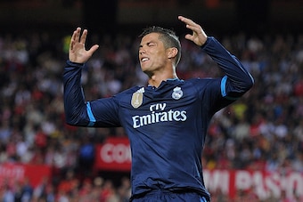 SEVILLE, SPAIN - NOVEMBER 08: (EDITORS NOTE: Retransmission of #496306432 with alternate crop.) Cristiano Ronaldo of Real Madrid reacts after his shot at goal was saved during the La Liga match between Sevilla FC and Real Madrid CF at Estadio Ramon Sanche
