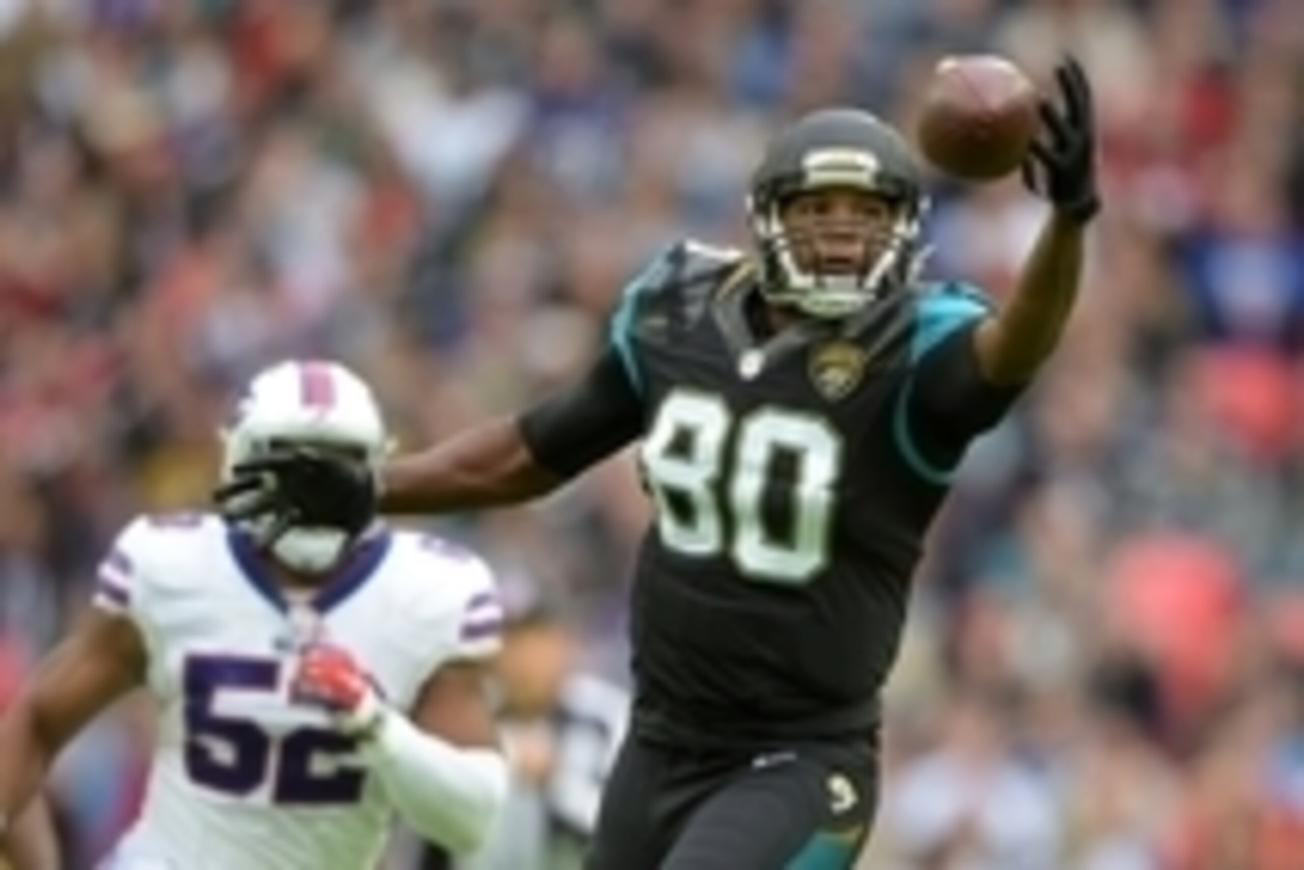 Oct 25, 2015; London, United Kingdom; Jacksonville Jaguars tight end Julius Thomas (80) attempts to catch a pass against the Buffalo Bills during NFL International Series game at Wembley Stadium. Mandatory Credit: Kirby Lee-USA TODAY Sports