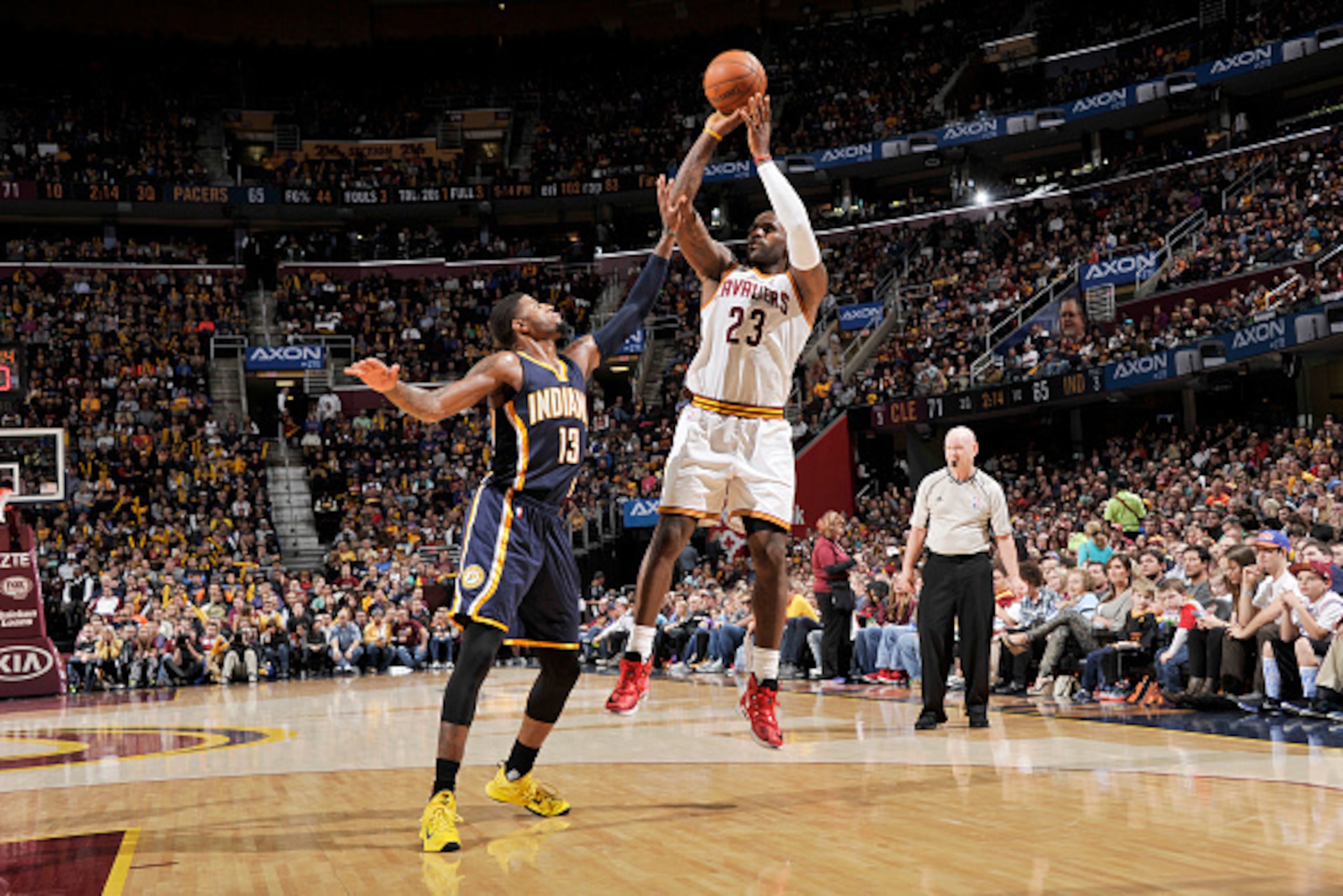CLEVELAND, OH - NOVEMBER 8:  LeBron James #23 of the Cleveland Cavaliers shoots the ball against Paul George #13 of the Indiana Pacers on November 8, 2015 at Quicken Loans Arena in Cleveland, Ohio. NOTE TO USER: User expressly acknowledges and agrees that