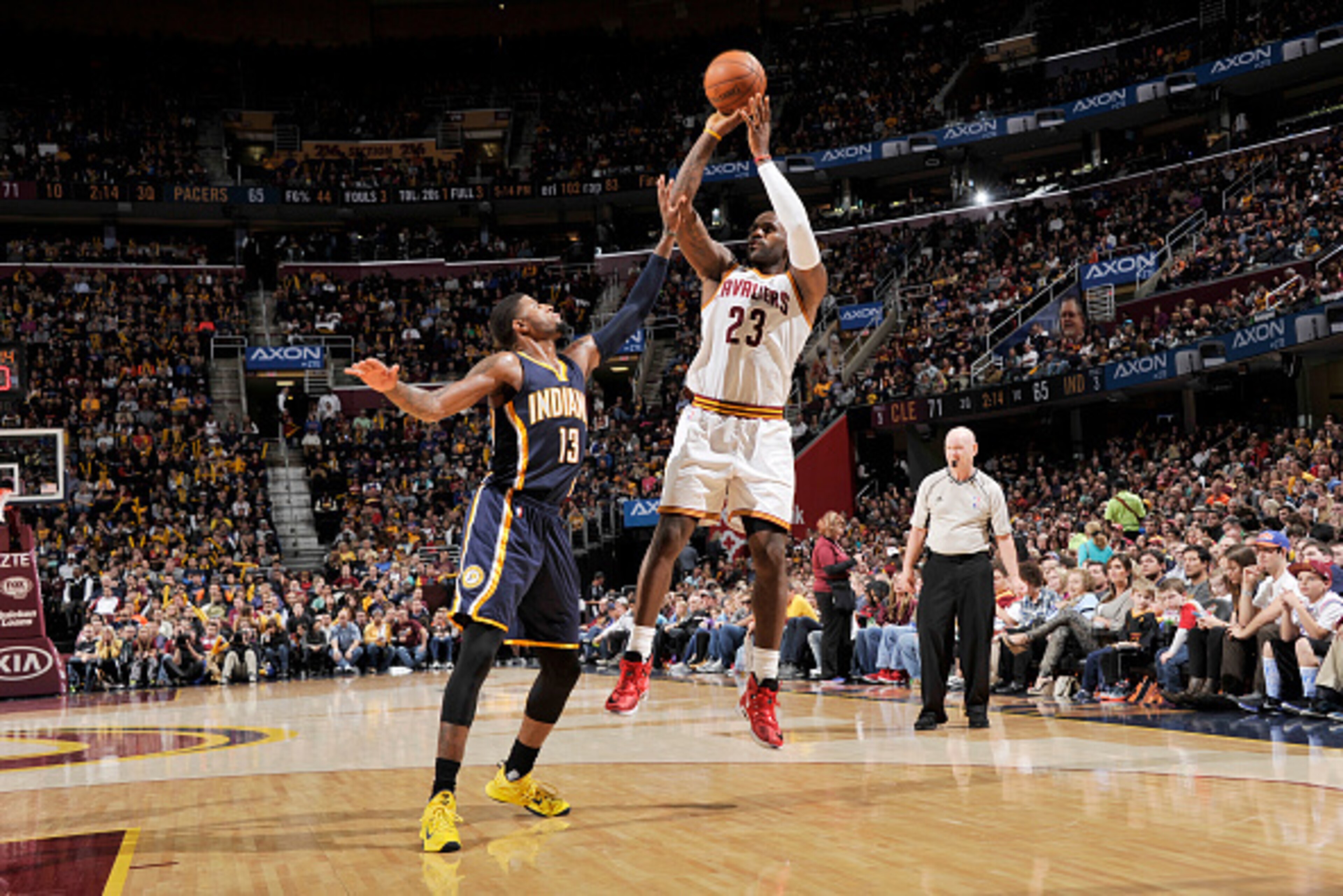 CLEVELAND, OH - NOVEMBER 8:  LeBron James #23 of the Cleveland Cavaliers shoots the ball against Paul George #13 of the Indiana Pacers on November 8, 2015 at Quicken Loans Arena in Cleveland, Ohio. NOTE TO USER: User expressly acknowledges and agrees that