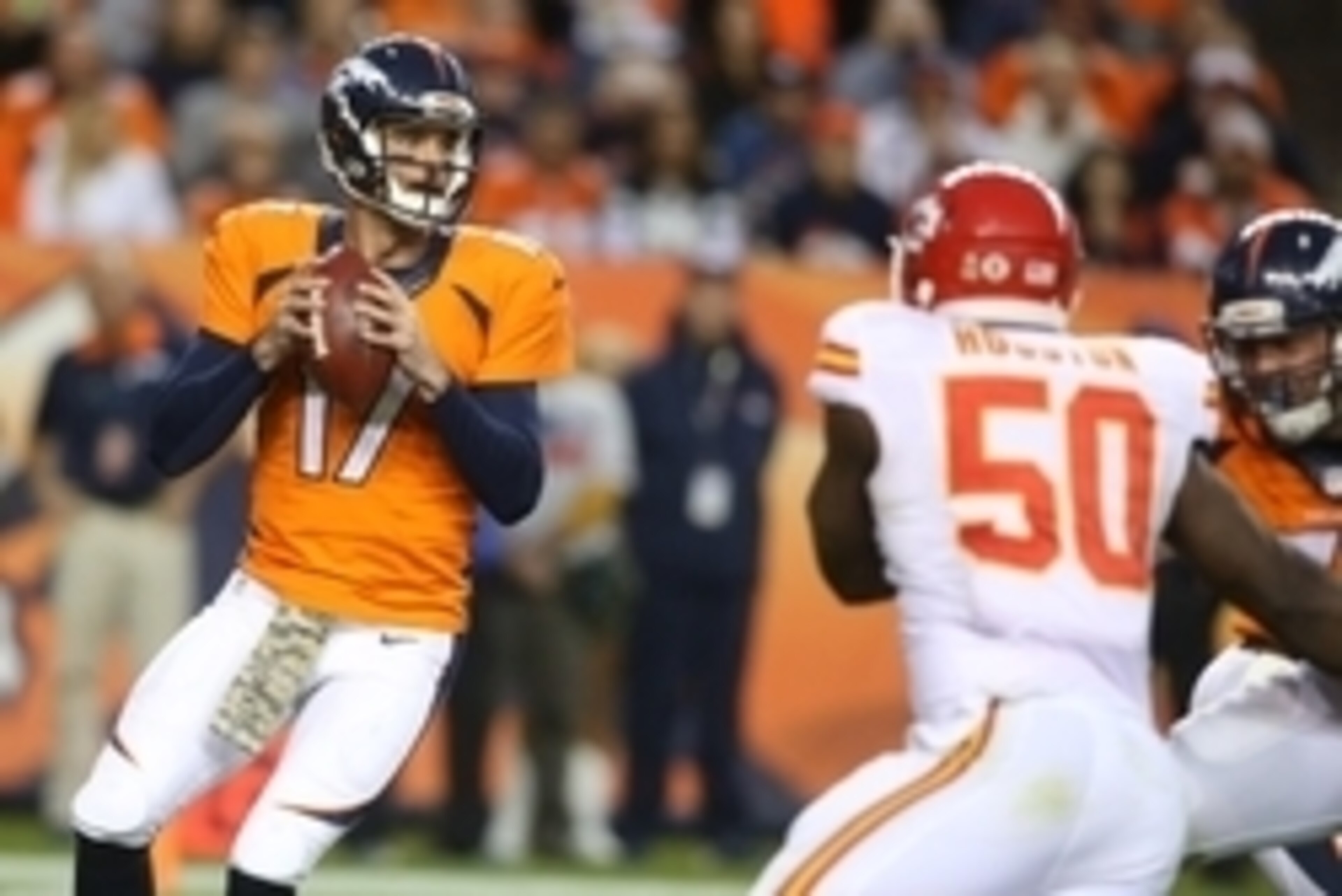 Nov 15, 2015; Denver, CO, USA; Denver Broncos quarterback Brock Osweiler (17) looks to pass the ball during the second half against the Kansas City Chiefs at Sports Authority Field at Mile High. The Chiefs won 29-13. Mandatory Credit: Chris Humphreys-USA 