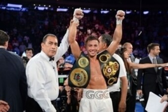 Jul 26, 2014; New York, NY, USA; Gennady Golovkin (white gloves) reacts after knocking out Daniel Geale (black gloves) during their middleweight championship bout at Madison Square Garden. Golovkin won via third round knockout. Mandatory Credit: Joe Campo