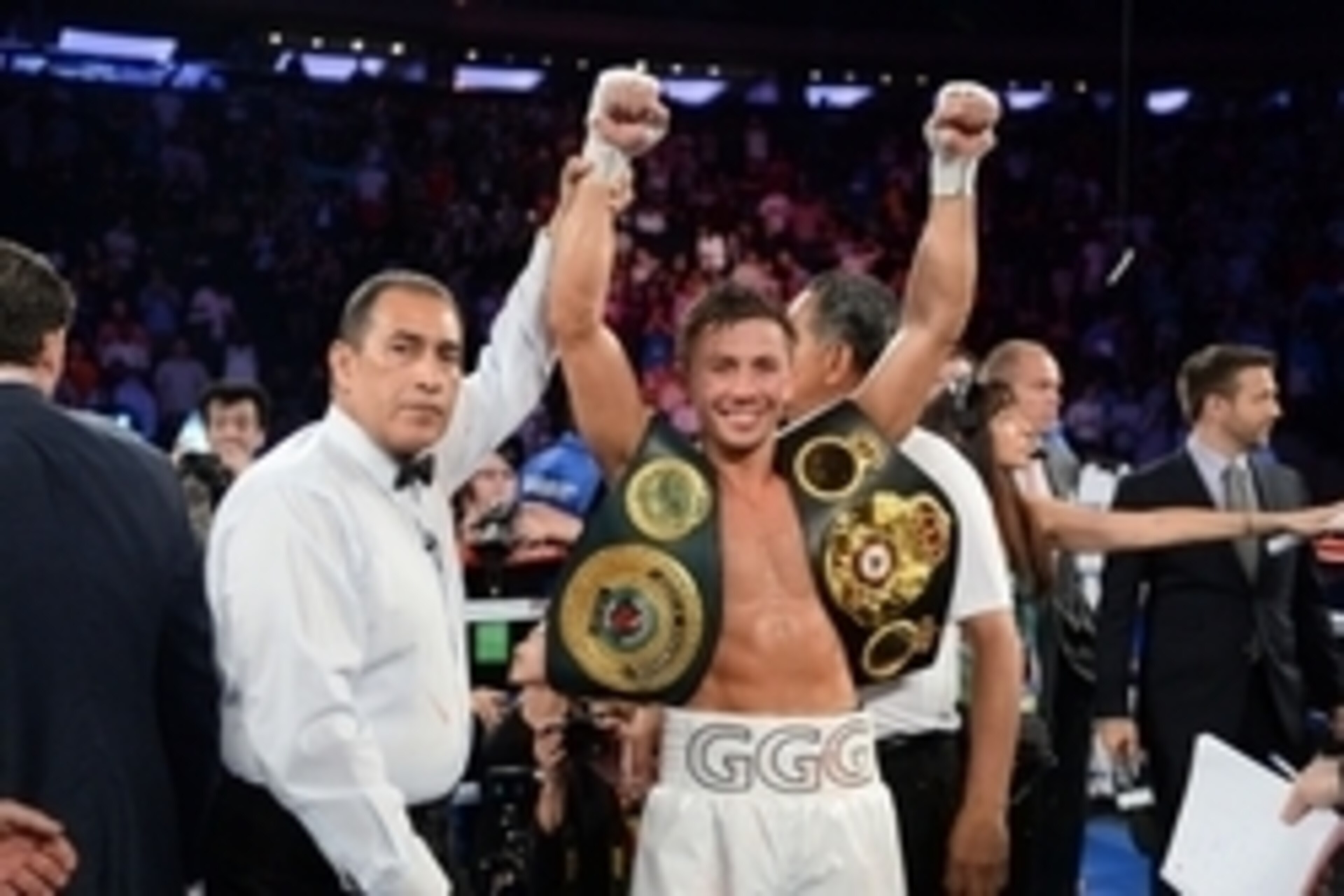Jul 26, 2014; New York, NY, USA; Gennady Golovkin (white gloves) reacts after knocking out Daniel Geale (black gloves) during their middleweight championship bout at Madison Square Garden. Golovkin won via third round knockout. Mandatory Credit: Joe Campo