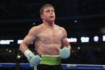 May 9, 2015; Houston, TX, USA;  Canelo Alvarez goes to his corner after a knock down during a super welterweight bout against James Kirkland (not pictured) at Minute Maid Park. Alvarez defeated Kirkland with a knockout in the third round. Mandatory Credit