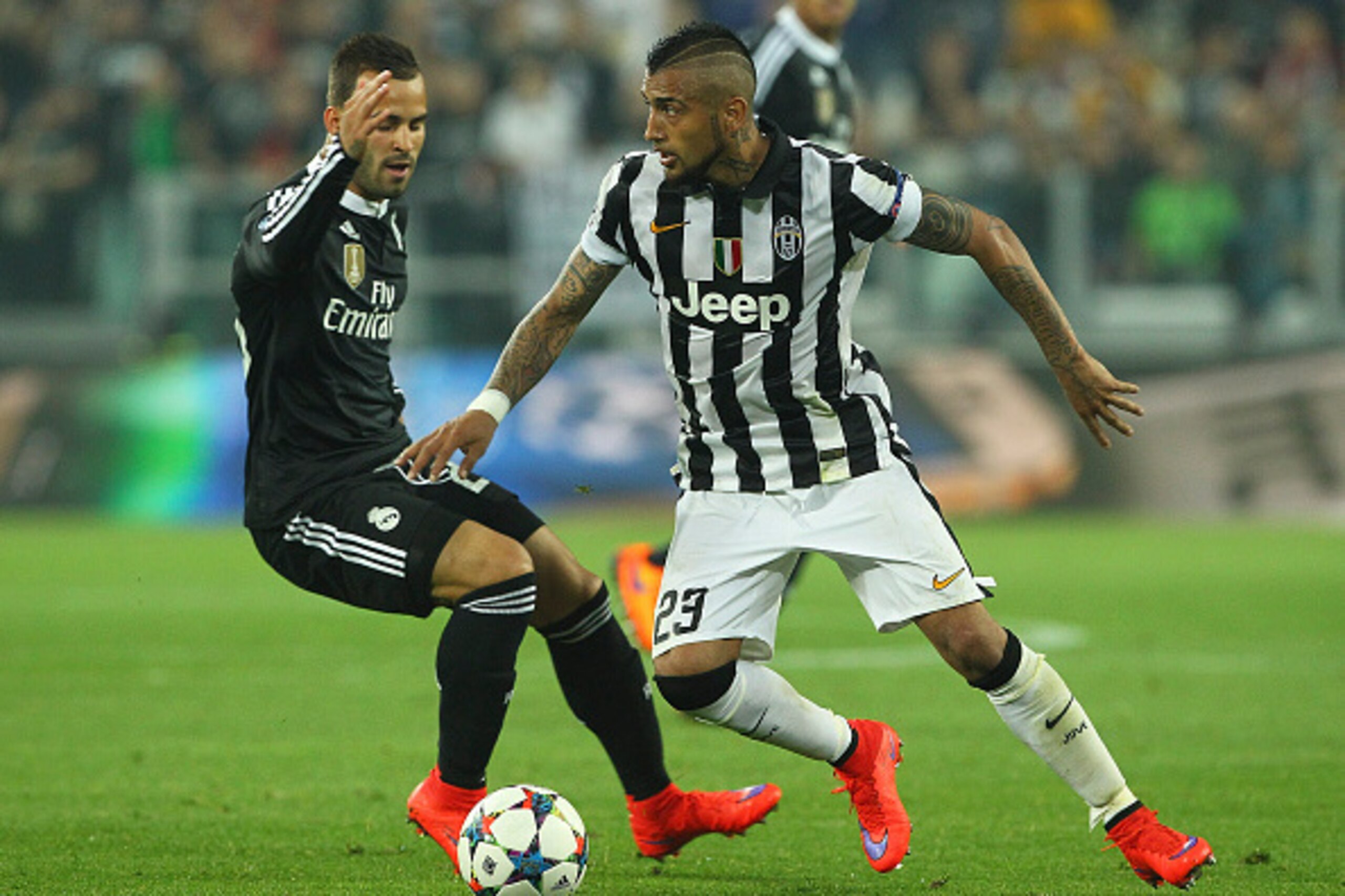 TURIN, ITALY - MAY 05:  Arturo Vidal (R) of Juventus FC competes for the ball with Jose (L) of Real Madrid CF during the UEFA Champions League semi final match between Juventus and Real Madrid CF at Juventus Arena on May 5, 2015 in Turin, Italy.  (Photo b