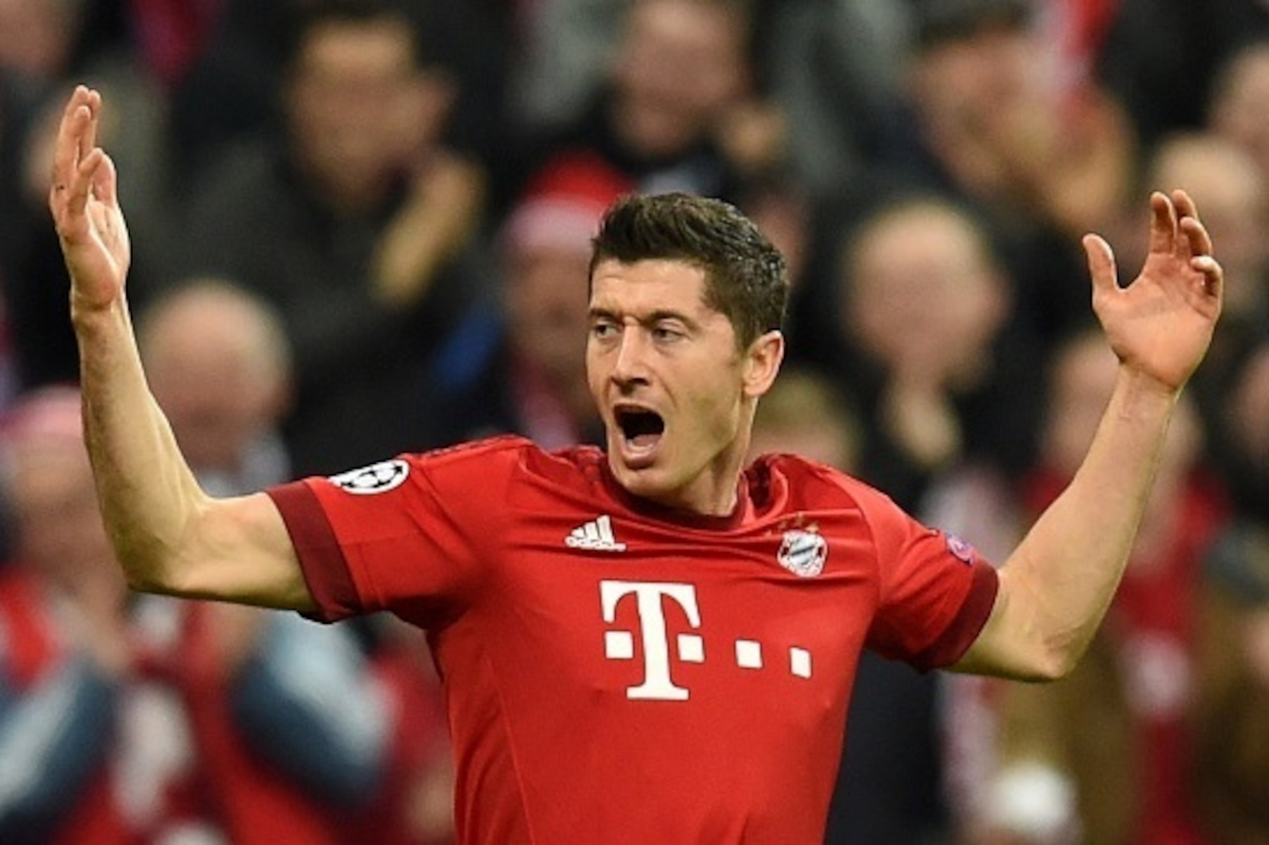 Bayern Munich's Polish striker Robert Lewandowski celebrates scoring the opening goal during the UEFA Champions League Group F second-leg football match between FC Bayern Munich and Arsenal FC in Munich, southern Germany, on November 4, 2015.  AFP PHOTO /