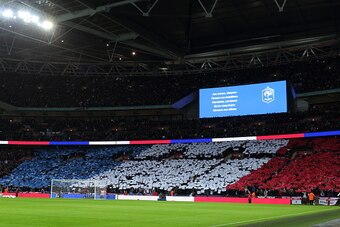 WEMBLEY, ENGLAND - NOVEMBER 17:  Fans of England display the national flag of France during the international friendly between England and France at Wembley Stadium on November 17, 2015 in London, England.  (Photo by Matthew Ashton - AMA/Getty Images)