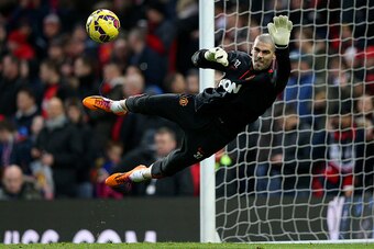 MANCHESTER, ENGLAND - JANUARY 11:  Victor Valdes of Manchester United takes part in the warm-up before the Barclays Premier League match between Manchester United and Southampton at Old Trafford on January 11, 2015 in Manchester, England.  (Photo by Clive