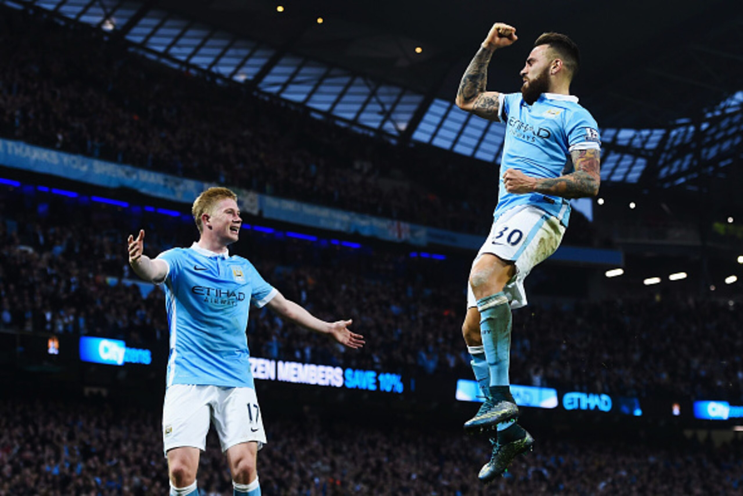 MANCHESTER, ENGLAND - OCTOBER 31:  Nicolas Otamendi (R) of Manchester City celebrates scoring his team's first goal with his team mate Kevin de Bruyne (L) during the Barclays Premier League match between Manchester City and Norwich City at Etihad Stadium 
