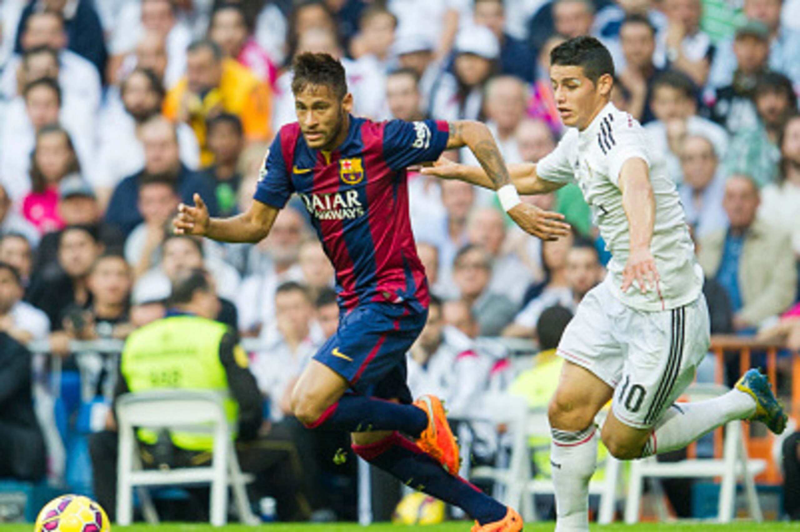 MADRID, SPAIN - OCTOBER 25: James Rodriguez of Real Madrid duels for the ball with Neymar of Barcelona during the La Liga match between Real Madrid CF and FC Barcelona at Estadio Santiago Bernabeu on October 25, 2014 in Madrid, Spain.  (Photo by Juan Manu