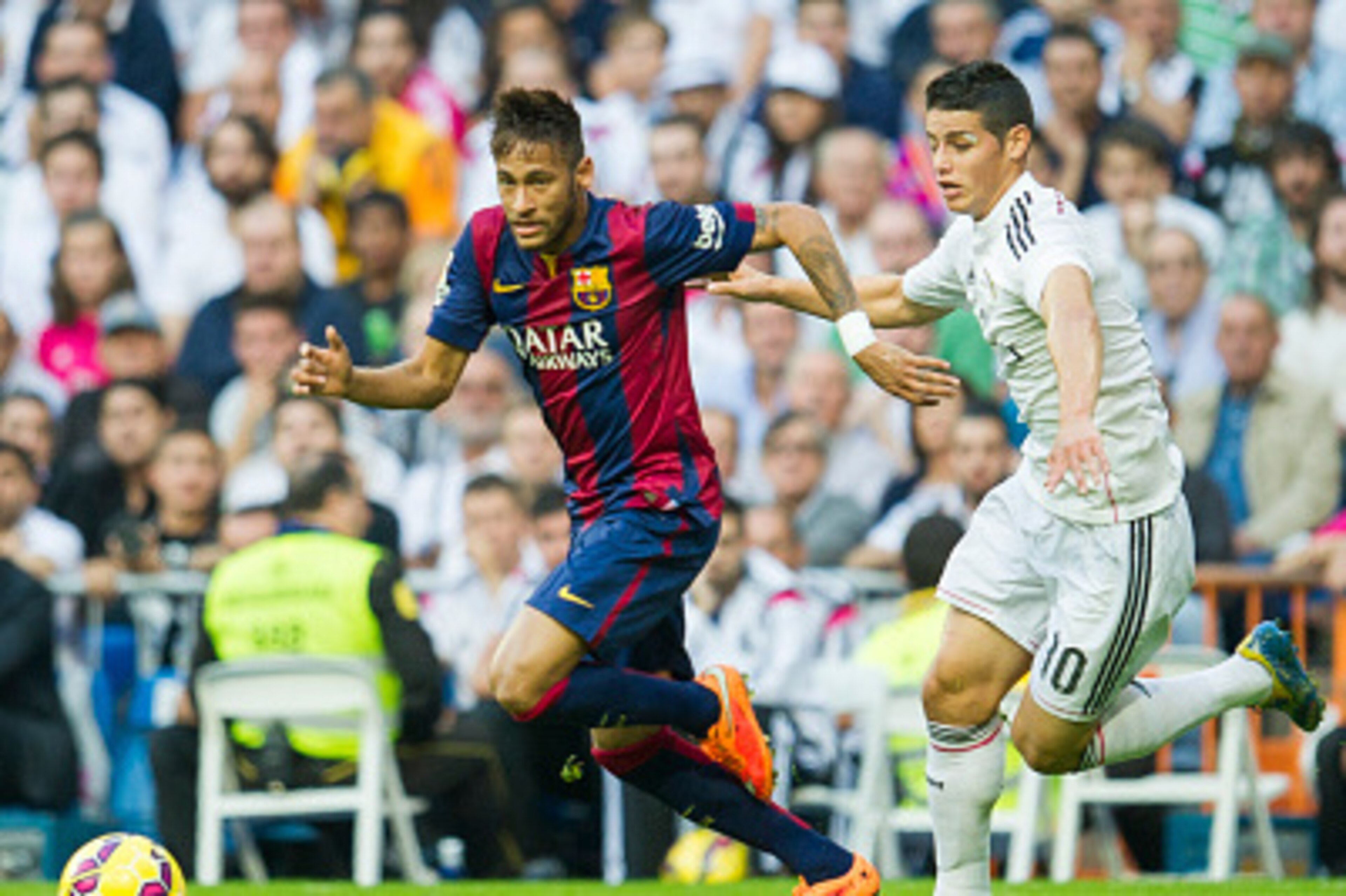 MADRID, SPAIN - OCTOBER 25: James Rodriguez of Real Madrid duels for the ball with Neymar of Barcelona during the La Liga match between Real Madrid CF and FC Barcelona at Estadio Santiago Bernabeu on October 25, 2014 in Madrid, Spain.  (Photo by Juan Manu